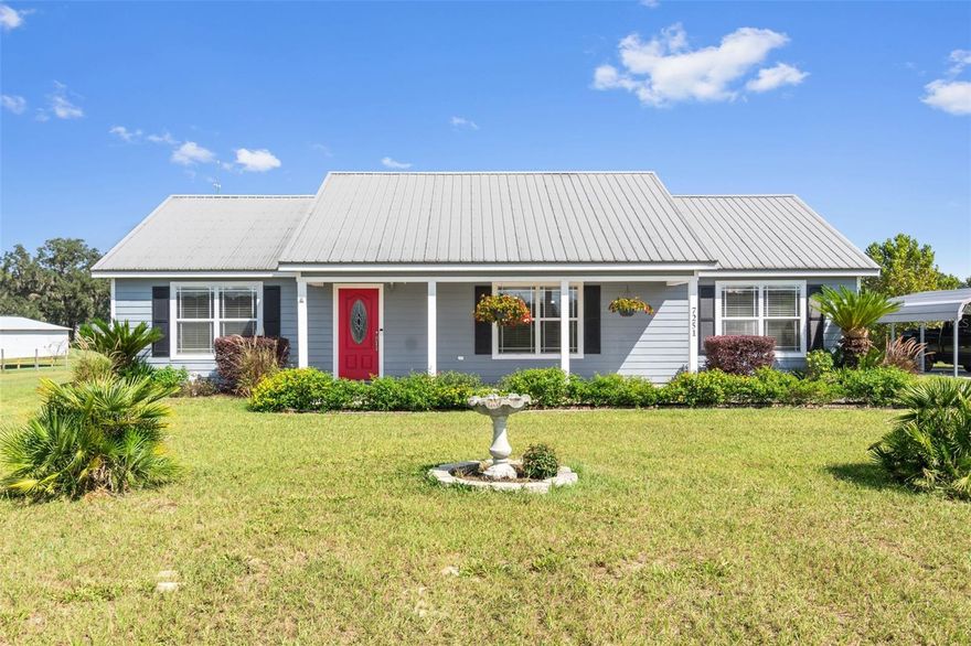 Relax and enjoy life in this bright and open floor plan home. It features a large great room with vaulted ceilings and a beautiful view of the lush field outside. The spacious kitchen boasts granite countertops, ideal for cooking and entertaining. The owner's retreat is generously sized, complete with a walk-in closet and an additional private entry door for securely storing special items. The luxury bathroom includes a walk-in shower with dual shower heads and separate his-and-her vanities. The additional bedrooms are also spacious and offer ample closet space. There's a convenient laundry room located just off the kitchen, equipped with cabinetry for extra storage. As you stroll up the front sidewalk, you'll be welcomed by lovely butterflies resting on the vibrant flowers that bloom in the yard. The outdoor space is filled with blooming plants, perfect for relaxation. Enjoy cooking out on the pavered lanai while watching the sunset. At night, you can appreciate the decorative lights installed in the lanai ceiling. The property also features a two-car carport for parking and a storage shed in the backyard. Plus, high-speed fiber cable available. Seller has installed fiberoptic internet in primary bedroom. This home is truly a gem and won't last long!