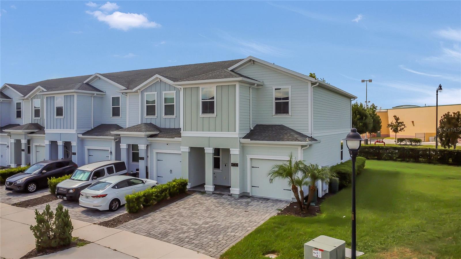 *CORNER UNIT townhouse PRIVATE with OVERSIZED DIVEWAY PARKING is in a GATED community with 3 bedrooms, 2.5 bathrooms, and nearly 1,800 square feet of living space, this impeccably maintained home was built in 2018. The home unfolds into an open-concept haven, seamlessly blending the kitchen, dining, and living room areas. The kitchen is a chef's dream, featuring timeless white cabinets with crown molding, a stylish backsplash, elegant grey QUARTZ countertops, and top-of-the-line STAINLESS STEEL appliances. For the convenience of your guests, a well-appointed half bathroom is also conveniently situated on this level. Ascending the stairs, you will discover all three (3) bedrooms, including the generously proportioned primary bedroom suite. Offering ample space for a king-size bed and adorned with tray ceilings. The primary bathroom is a luxurious retreat, showcasing a WALK-IN SHOWER, double vanity with quartz countertops, and a separate water closet. The two (2) additional bedrooms can be easily adapted for use as office space or guest accommodation. The community has true BUILT IN VALUE, taking care of not only exterior maintenance but also providing CABLE, INTERNET, and PHONE services. Furthermore, a wealth of amenities awaits, including a CLUBHOUSE, FITNESS CENTER, DOG PARK, PLAYGROUND, and a RESORT-STYLE SWIMMING POOL. Another remarkable feature of this townhouse is its SMART HOME capabilities, enabling you to control the front door lock, thermostat, garage door, pendant lights, and under-cabinet lighting all from the comfort of your home. The property also comes equipped with Wi-Fi extenders for seamless connectivity. IDEAL LOCATION, with shopping, restaurants, and theme parks all within easy reach. The townhome is situated just 1 mile from the nearest Target, 2 miles from the nearest Publix, and a mere 6 miles from Disney property. If you are searching for a home that flawlessly combines upgrades, smart home features, community amenities, and a prime location near shopping, theme parks, and dining options, your search ends here. Contact us NOW, let’s set up your private showing, TODAY!