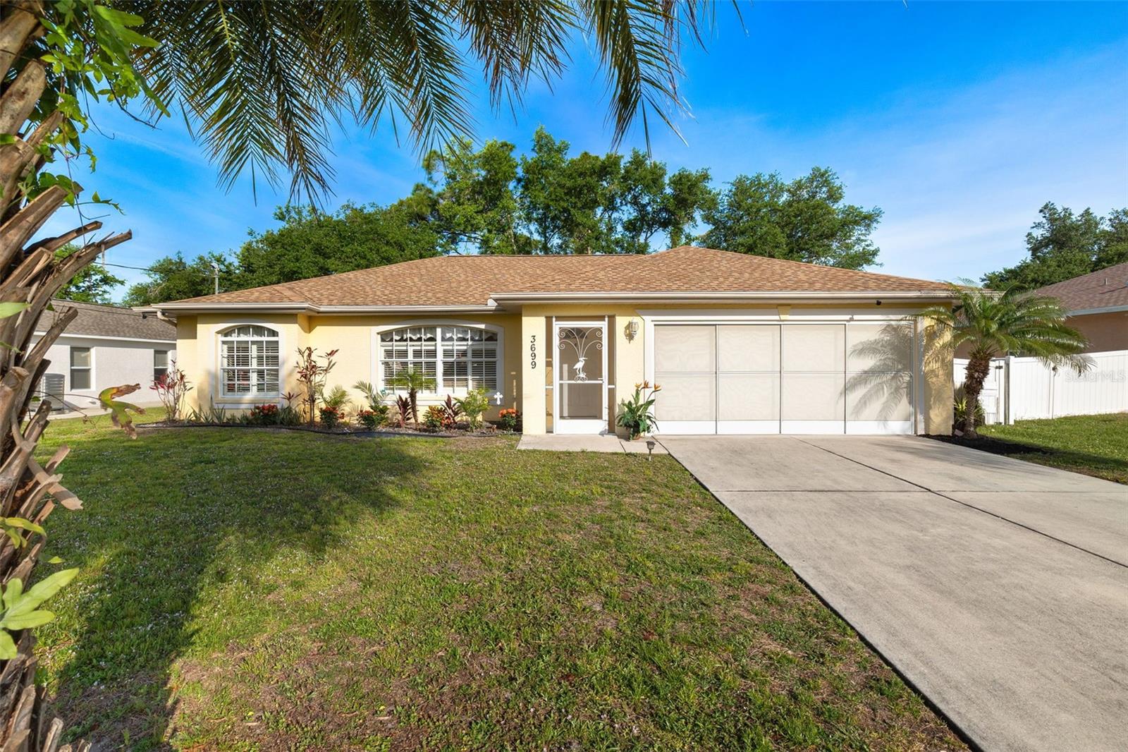 This is the TURNKEY, FULLY FURNISHED home you've been searching for! Don't let this opportunity pass you by - a beautiful pool home with a NEW ROOF installed in 2023, on city water and LOCATED CENTRALLY in North Port (3 minutes from I-75)! Experience luxury living in this 3 bed, 2 bath home featuring a SALTWATER POOL with SPA and an open concept floor plan. The master suite offers direct access to the beautiful pool area through the sliding glass doors off the suite. Looking for a large yard too? Look no further! This home offers ample YARD SPACE for family, pets, or entertainment! Additional features include vinyl fencing around the property line, 8ft X 16 ft workshop with electricity, walk-in shower in master, garden tub in guest bath, newer pool pump(2021), newer pool heater (2019), and expansive lanai with NEWER DECKING (2021).Explore this MOVE-IN READY Home, NOT IN A FLOOD ZONE! Ideal for Retirement, Snow Birding, or as a Starter Home. Schedule an Appointment to View this Immaculate Property Today!