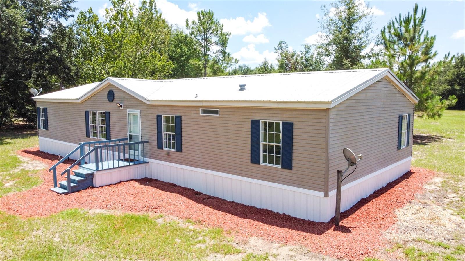 Peaceful 5-Acre Property in the Heart of North Florida-
Enjoy country living on this hard-to-find 5-acre parcel in a quiet, desirable area. The land is high and dry, partially cleared, and ready for your animals, garden, or future plans—perfect for those looking for space and freedom in a natural setting.
The well-maintained 1996 double-wide mobile home features a durable metal roof (2015), 4 bedrooms, and 2 bathrooms. Recent updates include new bathroom flooring, updated bathrooms, interior paint, a new garbage disposal, and a newer water heater.
Outside, you'll find a 20x36x12 steel carport and a 10x20x8 shed with a metal roof, offering great storage or workspace options. The property also has two 10” wells, and lower monthly utility bills thanks to Central Florida Electric Co-op.
With no deed restrictions, this property offers true flexibility—bring your chickens, animals, and outdoor equipment. A rare opportunity for 5 acres in this location—don’t miss it! PLUS Seller is offering a $5k buyer credit!