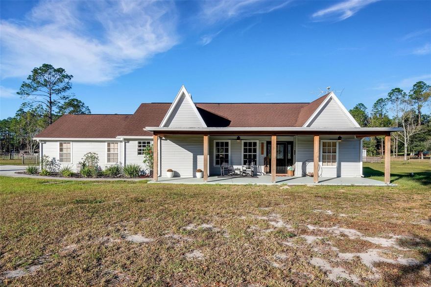 Welcome to the serenity of country living in the picturesque hills of Dade City, nestled within the sought-after Hyland Farms community of Pasco County, FL. This 5.21-acre property invites you to embrace a harmonious blend of modern living and the tranquility of the countryside.

As you enter through the elegant wrought iron front gate, be prepared to be captivated by breathtaking views that stretch as far as the eye can see. Enjoy mesmerizing sunsets over the expansive landscape adorned with majestic oak trees and pines, creating a natural oasis on your very own estate.

This open-concept home spanning 2724 sqft. offers a perfect balance of functionality and comfort. With 3 bedrooms and an oversized bonus room and 2 1/2 bathrooms, this residence caters to various lifestyle needs. The bonus room boasts a stunning view of the pool area and the vast backyard, providing versatility as an office, guest room, or gym.

The upgraded kitchen features light and bright countertops, wood laminate floors, and premium cabinets, setting the stage for culinary delights. Revel in the warmth of the real wood burning fireplace during the occasional chilly Florida nights. The primary bedroom, living, dining, and entrance areas boast wood laminate floors, while the remaining rooms offer plush carpeting.

Designed for outdoor entertainment, the back patio is an inviting haven with an expansive covered area and a high screened enclosure. Dive into the solar-heated, saltwater pool with changing LED lights, or gather around the 8ft stone fire pit for bonfires under the stars. The property is a haven for entertaining.

A 30x30 enclosed barn with dual bay doors awaits, complete with electricity. The 8x16 chicken coop comes equipped with an automatic waterer, catering to those looking to embrace a self-sufficient lifestyle. The property is cross-fenced, ensuring the safety of your livestock while preserving the lawn.

Hyland Farms, a deed-restricted community with remarkably low HOA fees and no CDD, offers a peaceful retreat just minutes away from I-75, schools, and shopping. The property is a short 40-minute drive to Tampa, providing the perfect balance between rural tranquility and urban convenience.

Immerse yourself in the sights and sounds of nature, from the vibrant cardinals to the rhythmic woodpeckers, all enjoyed from your front porch or kitchen window. 

Picturesque landscapes are captured in photos, but the true essence of this property can only be experienced in person. Don't miss the opportunity to make this exceptional estate your own. Schedule your showing today and step into the perfect blend of luxury, comfort, and rural charm.

Roof: 9 years old
AC: 2018
Water Heater: 2017