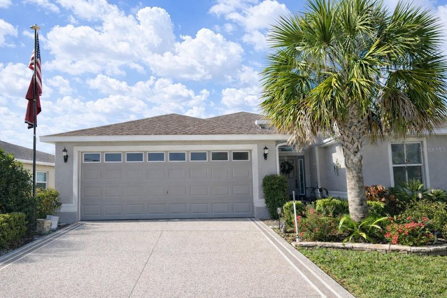 Welcome to a life that feels like vacation every day. Nestled in one of Central Florida’s most desirable resort-styled, guard-gated, active-adult golf communities, this beautiful low-maintenance 3-bedroom 2 bath stucco home with over-sized 2 car garage built in 2019 This home delivers the comfort, quality, and freedom you’ve been dreaming of all without the resort price tag. Every detail has been thoughtfully cared for giving you peace of mind and more time to enjoy the things you love. Step inside open-concept home and feel the spacious flow of the 22x16 great room with high ceiling to enhance your sense of space is perfect for relaxed evenings or lively gatherings with friends. The chef’s kitchen is inspired with its natural gas stainless steel range, pantry, and 4-seat bar-top island that’s made for morning coffee and good conversation. The split-bedroom layout offers privacy for you and your guests, while the owner’s suite invites you to unwind with dual vanities, a walk-in shower, private toilet and walk-in closet. The split bedroom floor plan provides the privacy you need. Step out on to your 28x10 covered & screened lanai and breathe in the tranquility of surrounding greenery while sipping your morning coffee or afternoon margarita, With its energy efficient foam-filled insulated block and stucco construction, high elevation, and insurance savings for wind and flood protection, this home offers strength and serenity in equal measure. But what truly sets this home apart is the lifestyle. Arlington Ridge is more than a community it’s a way of living. Spend your mornings on the championship 18-hole golf course, your afternoons at the heated pools or fitness center, and your evenings with neighbors at the on-site restaurant, tavern, or free movie theater. Enjoy tennis, pickleball, billiards, or a peaceful stroll along golf cart-friendly streets lined with sidewalks and manicured landscapes. With a remarkably low HOA of just $125/month, you’ll enjoy included lawn care, high-speed internet, Wi-Fi, and over 200 cable channels. With hardly any yardwork to worry about, What will you do with all your free time? Conveniently located near shopping, dining, medical services, and a short drive to Orlando’s attractions and both coasts’ beaches, this home blends resort-style living with everyday practicality. Don’t just buy a home, embrace the lifestyle you worked hard for and deserve. Schedule your private showing today and start living your best Florida life at Arlington Ridge. Retirement is not the end, it’s a new chapter just beginning. YOU ARE NOT REQUIRED TO PURCHASE A SOCIAL OR GOLF MEMEBRSHIP TO USE THE AMENTIES!