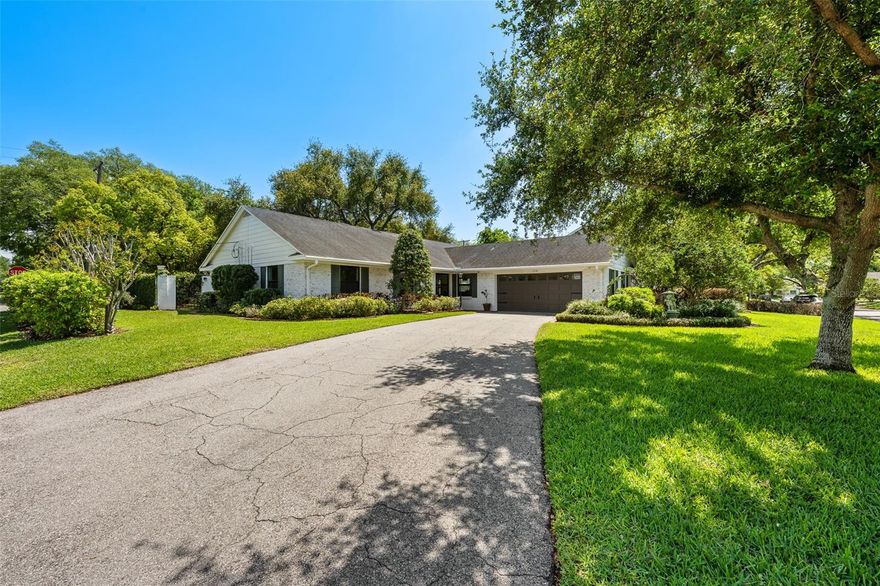 Exceptionally rare single-story home in sought-after Culbreath Bayou that has never received any flood damage.
Meticulously reimagined with an uncompromising commitment to quality, this residence showcases a level of craftsmanship and material selection rarely found in this price range. Unlike typical renovations, every detail has been thoughtfully curated—from custom Conestoga Wood Specialties inset cabinetry and imported Armac Martin hardware from England, to a leathered Taj Mahal quartzite island selected for its natural movement and understated elegance. Materials and finishes have been sourced from across five continents, resulting in a home that feels both globally inspired and timeless in execution. At the heart of the home, the kitchen is a true statement in scale, openness, and bespoke design. A substantial 10-foot rift-cut white oak island anchors the space, offering expansive prep, storage, and gathering areas beneath a stunning natural stone surface. The kitchen is outfitted with a professional-grade appliance suite, including a Wolf range, Sub-Zero refrigeration with integrated drawers, a Miele panel-ready dishwasher, and a custom Hoodsly wood hood with Vent-A-Hood ventilation. Full-height cabinetry, specialty storage, and layered custom finishes create a kitchen that is as functional as it is visually striking. Yet what truly sets this kitchen apart is something you don’t immediately see—it’s something you feel. The energy, thought, and intention poured into this space elevate it beyond what photography can capture. It lives and performs at a level rarely found, even in homes priced at more than double this offering. Flowing seamlessly from the kitchen, the living spaces are grounded by wide-plank white oak. A dramatic oversized picture window transforms the living room into a serene, light-filled retreat, perfectly framing the home’s lush, private backyard like a living work of art. From this central gathering space, the view creates the rare feeling of being immersed in nature while enjoying the comfort of air-conditioned interiors. The sense of connection begins the moment you arrive. The custom ProVia impact-rated front door, flanked by sidelights and topped with a transom, creates a warm and inviting entry while offering a direct line of sight through the home to the backyard beyond. Set on a generous corner lot, the outdoor space is equally compelling. The backyard offers ample room to create a spectacular private pool and spa retreat, thoughtfully positioned to take full advantage of the home’s front-to-back sightlines. Envision entering the home and being instantly drawn to a stunning outdoor focal point—where shimmering water, elegant hardscape, and lush landscaping create a resort-like first impression. From the main living areas, the future pool would feel like a natural extension of the home, offering serene, framed views and a seamless indoor-outdoor lifestyle. One especially striking concept includes an elevated rear pool wall with fire bowls, adding layers, movement, and dramatic visual depth. The outdoor setting itself is already a private, garden-inspired retreat, anchored by a magnificent mature oak canopy and expansive paver patio designed for both quiet enjoyment and entertaining. This is more than a renovation—it is a complete reimagination of what a single-story home can be, combining openness, scale, craftsmanship, and design into a residence that feels both elevated and effortlessly livable.