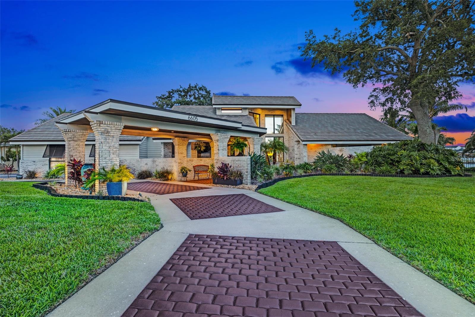 Apollo Beach Waterfront Luxury – Island Vibes, Entertainer’s Paradise & Boater’s Dream
Discover the ultimate in Florida coastal luxury with this exceptional resort-style estate, perfectly situated on a double lot with 160 feet of waterfront along Apollo Beach’s premier wide canal. This custom 4-bedroom, 3.5-bath masterpiece offers nearly 4,000 sq. ft. of elegant living space—complete with no HOA or CDD fees.
Inside, experience soaring tongue-and-groove ceilings, a stone fireplace, and an open-concept layout designed for comfort and style. The chef’s kitchen features quartz countertops, high-end stainless appliances, double ovens, and a butler’s pantry. The primary suite is a private retreat with a spa-style bath, walk-in shower, soaking tub, outdoor access, and a climate-controlled loft perfect for a home office or reading nook.
Step outside into your private oasis—an entertainer’s dream. Enjoy a 40,000-gallon heated saltwater pool, outdoor kitchen and bar, fire pit patio, and a hammock set on sugary sand—all surrounded by lush tropical landscaping.
Boaters will love the private dock with a 12,500-lb covered lift, second lift for jet skis/kayaks, and direct, bridge-free access to Tampa Bay.
With hurricane-impact windows, Bimini shutters, motorized blinds, and a designer tile roof, this waterfront gem is truly one-of-a-kind. Schedule your private showing today.