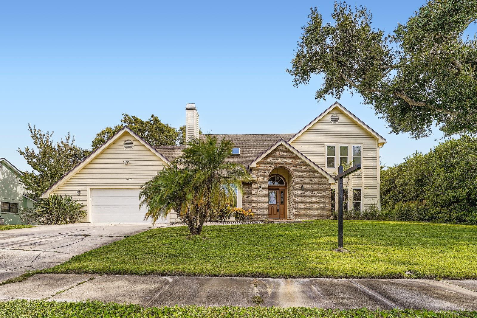 One or more photo(s) has been virtually staged. Discover this exceptional Dunedin pool home—a true gem in one of the area’s most desirable neighborhoods! Perfectly located just 10 minutes from Honeymoon Island Beach and minutes from other world-class beaches, the Pinellas Trail, shopping, dining, golf courses, and the Dunedin Recreational Center. This sprawling 4-bedroom, 3.5-bath residence offers the ultimate Florida lifestyle.
Impressive curb appeal greets you with rich brick accents. Inside, you’ll find a spacious living and dining area featuring elegant French doors, a sunken living room and a gourmet chef’s kitchen equipped with stainless steel appliances, extensive cabinetry, and a center island overlooking a bright breakfast nook with beautiful pool views.
The main-level master suite is oversized, boasting a large walk-in closet with custom organizers and a fully remodeled, luxurious master bath featuring high-end finishes and a modern bidet. Upstairs, a second master suite offers a spa-like retreat with a jetted Jacuzzi tub, separate shower, and access to a huge screened balcony overlooking the lush pool area and exquisite landscaping. Two additional guest bedrooms and baths provide plenty of space for family and visitors.
Recent upgrades include hurricane-impact windows throughout, 2 new AC systems, fresh interior paint, new carpeting in bedrooms, and ceramic tile flooring in living areas. The roof is certified by a licensed roofer to have 5+ years of life for insurance and peace of mind. The backyard is a private oasis with a large lanai with new pavers, refinished pool surface and plenty of room for relaxing and entertaining by the sparkling pool.
This move-in ready home blends style, comfort, and durability—schedule your showing today and fall in love!