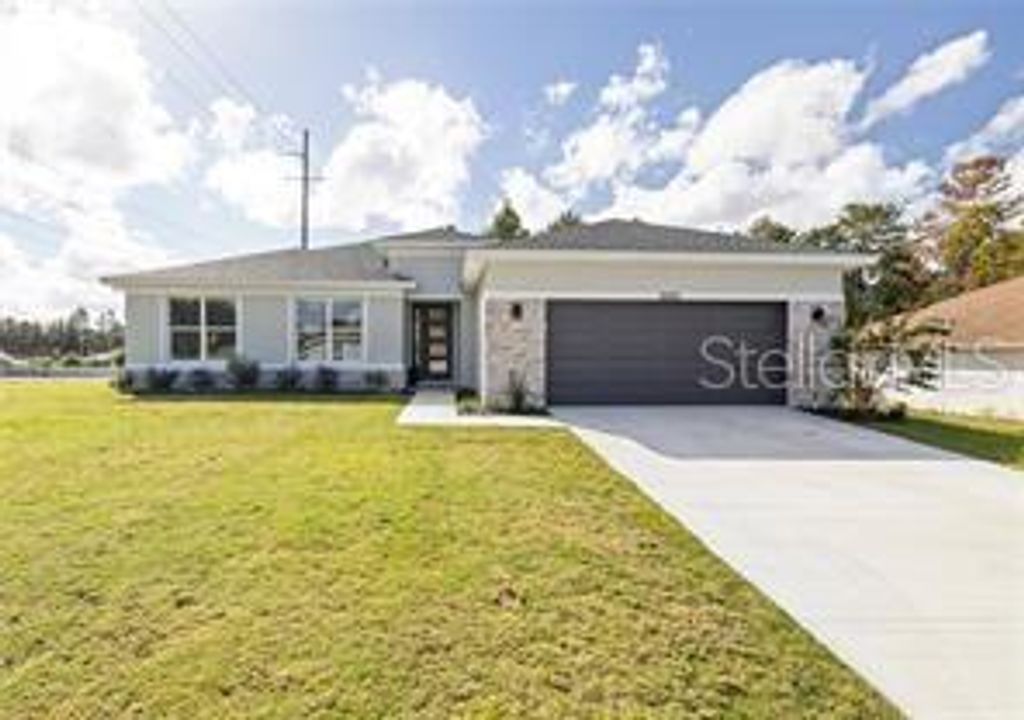 Photo of 697 Marion Oaks Ln, Ocala, FL 34473 (MLS # OM712287)