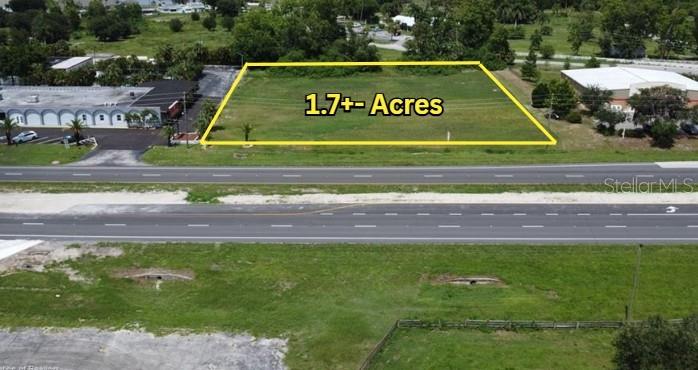 1.7+- Acre 220+-Ft Highway Frontage Lot Zoned R3 Adjacent & between Ramada Inn & New Family Dollars Store which both have full median turns and the turn/ intersection by Family Dollar is also the main entrance to Sun N' Lake Waterfront Community with good potential for a future traffic light. Buy this strategic property today before more businesses like the New Amazon distribution come while many local thorough fares and other intersections are expanding getting ready for the eminent growth scheduled to come to Highlands County. Not only is this a strategic parcel but also has a tranquil view across US 27 of Lake Buck. This site would lend well to Spa or other business benefiting from being located by the Hotel & retail corner.