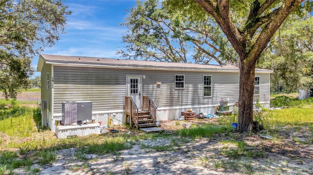 Photo of 16280 SE 172nd Place, Weirsdale, FL 32195 (MLS # OM728349)