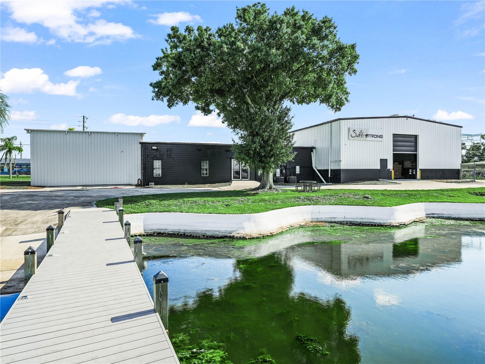 Under contract-accepting backup offers. Discover a rare and versatile investment opportunity with this 9,125 SF Showroom/Warehouse, fully renovated in 2023 and ideally located on Winter Haven's coveted Chain-Of-Lakes. Future Land Use of Commercial Enclave (CE) allows for a diverse range of uses including marinas, dry rack storage and related facilities, community centers, lodges and retreats, nightclubs, restaurants, retail, office, leisure and special interest schools, hotels/motels, water ski schools, and recreation and amusement venues. 1.79 Acres of lakefront property with 430 feet of shoreline on Lake Shipp, this high traffic location offers unmatched potential for special-purpose or marina-focused development. 405 feet of road frontage on Lake Shipp Drive ensures excellent visibility and access. Whether you're envisioning a waterfront restaurant, boutique hotel, or recreational facility, this site offers the zoning, location, and infrastructure to bring your vision to life. Don’t miss the opportunity to capitalize on this unique and highly flexible commercial real estate asset.