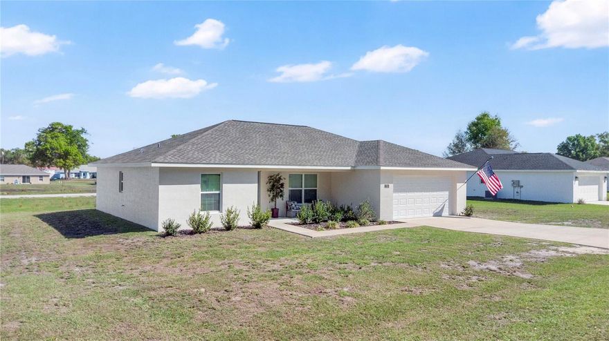 Tucked away in the peaceful countryside of Citra, this newly built 2024 home offers modern comfort with a functional and inviting design. Featuring 3 bedrooms and 2 bathrooms across 1,433 square feet of living space, the thoughtfully designed split floor plan provides both privacy and everyday convenience.

The heart of the home is the open kitchen and living room combination, creating a bright and welcoming space perfect for gathering with family or entertaining guests. A mix of tile and carpet flooring adds both style and comfort throughout the home. The kitchen flows seamlessly into the main living area, making it easy to stay connected while cooking, dining, or relaxing.

The private primary suite is positioned separately from the additional bedrooms, offering a quiet retreat at the end of the day. Two additional bedrooms and a full bathroom provide flexibility for family, guests, or a home office.

Built with durable block and stucco construction, this home also features a shingle roof, heat pump HVAC system, septic system, and an attached two-car garage for added storage and convenience.

Enjoy the benefits of brand-new construction in a quiet North Central Florida setting while still being within reach of nearby amenities, outdoor recreation, and the natural beauty that makes this area so desirable.

Schedule your private showing today