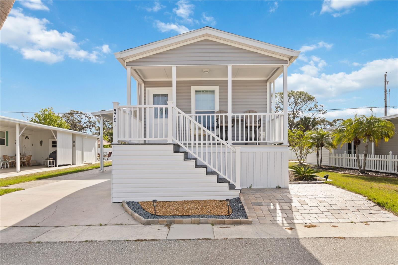 MOTIVATED SELLER!! Discover this charming 2-bedroom, 2-bathroom manufactured home at 5781 Orange Blossom Rd, nestled in the desirable 55+ community of Japanese Gardens in Venice, Florida. Built in 2023 to Wind Zone III standards, this home offers modern comforts and durability. Inside washer and dryer!! The open floor plan is perfect for entertaining, featuring a well-appointed kitchen with ample cabinetry and a convenient breakfast bar. Both bedrooms offer spacious closets, with the master suite boasting an en-suite bathroom for added privacy. Stylish vinyl plank flooring runs throughout the home, providing both aesthetic appeal and easy maintenance. Enjoy outdoor living with a west-facing front porch, perfect for watching sunsets, and a beautifully designed backyard with a brick paver patio, seating area, BBQ grill, umbrella, lighting, and multiple electrical outlets. A large shed offers additional storage, and a carport is set to be added soon. This fully furnished, move-in-ready home is just 2 miles from Manasota Beach, with access to fantastic community amenities, including a clubhouse, heated pool, pickleball and shuffleboard courts, and a spa/hot tub. The affordable monthly HOA fee of $254 covers cable TV, community pool maintenance, sewer, and water. Experience the best of coastal living in this vibrant, pet-friendly community—schedule your showing today!