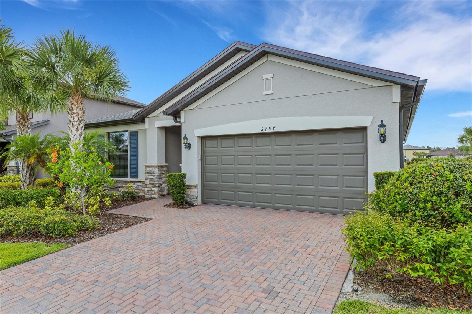 Welcome to this beautiful 3-bedroom + den, 2-bath home, not in a flood zone, in the sought-after Cedar Grove community! This home boasts over 2,000 sq ft thoughtfully designed living space. Step inside to a bright, open great-room floor plan featuring tile flooring throughout the main living area. The heart of the home is the kitchen, where you'll find ample white cabinetry with an oversized kitchen island, perfect for entertaining, with quartz countertops and beautiful glass-tile backsplash with under-cabinet lighting. The primary suite is complete with a large walk-in closet, dual sinks, and an oversized walk-in shower. The generously sized guest bathroom is located just outside your two guest bedrooms. The den provides a versatile space — ideal for a home office, music room, or extra guest area. Step outside to your private, designer, automated saltwater pool and spa overlooking a beautiful pond creating a peaceful oasis. The lanai also features roll-down Kevlar fabric shutters to protect the lanai. This home is move-in ready with impressive updates, including a new roof (2022) and hurricane shutters. You'll love Cedar Grove's amazing amenities, including a community pool and playground, and the convenience of living only a few miles from I-75, local shopping, golf courses, and entertainment.