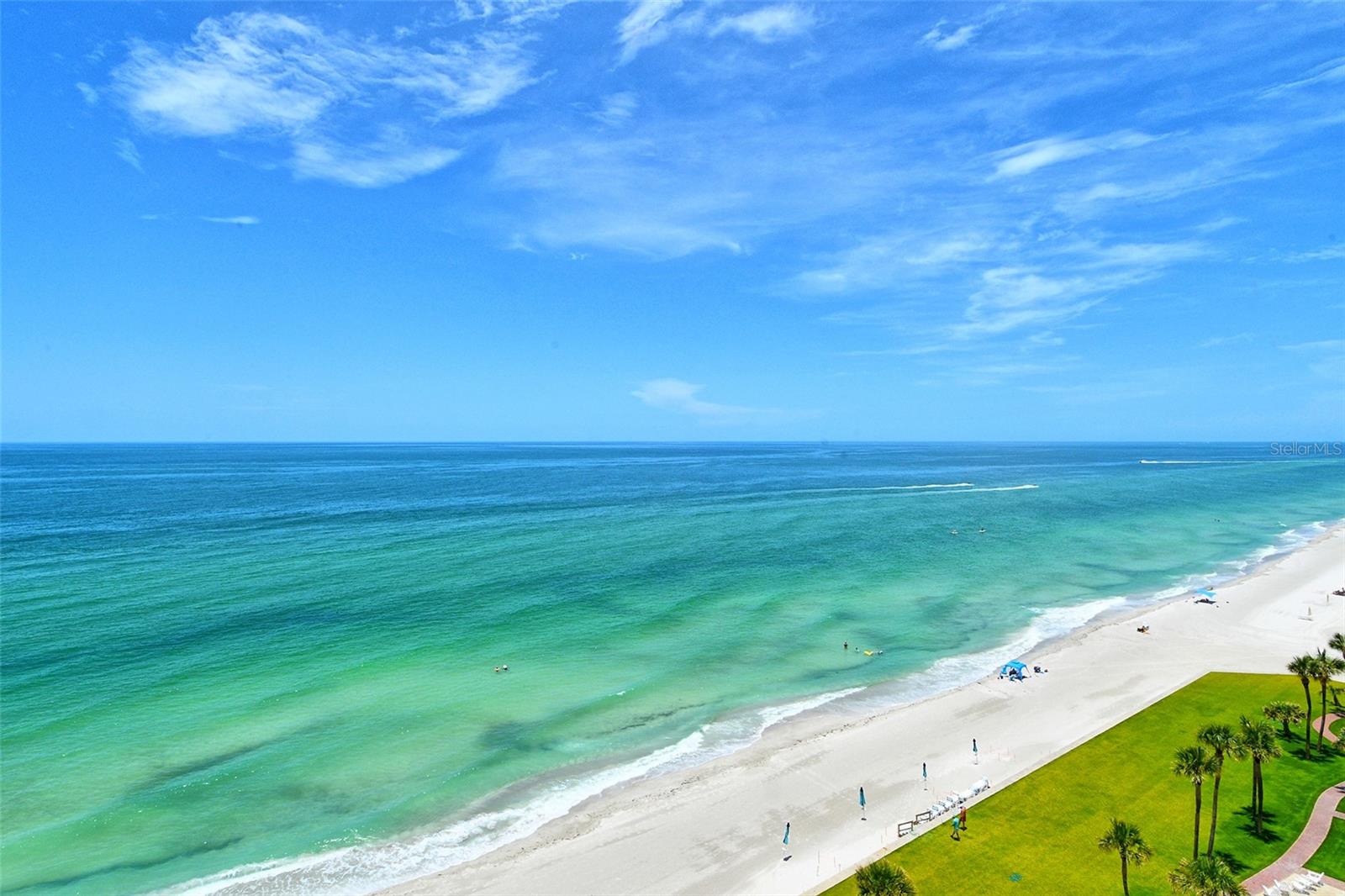 Rarely available and beautifully renovated 11th floor Penthouse with breathtaking Gulf, Sunset and Bay views and ideally situated within a short beach walk between the popular Resort at Longboat Key Club and the luxurious St. Regis Resort. This island gem has brought many years of joy to the Seller based on its perfect South LBK beachside location and all it's resort style amenities. The sleek European style interior boasts carefree luxury vinyl plank flooring, along with new carpeting in both bedrooms, LED lighting, dazzling designer tile in both bathrooms, and the color scheme throughout mirrors its direct seaside setting. The open-concept kitchen makes entertaining a breeze and offers gorgeous quartz counter tops, custom backsplash, stylish GE appliances, sparkling hardware, and a customized breakfast bar. Both the primary and guest bedroom each lead to a separate balcony where you can soak up the sun while enjoying the peaceful surroundings and endless water and beach views. Residents enjoy the convenience of on-site management, an updated guest suite & additional guest quarters for your overflow visitors, a secure lobby, tennis and pickle ball, heated pool and spa, a great gym, and a refurbished lobby, hallways, social room, community bathrooms, and the landscaping create an even more exceptional experience in this world-class beach location. A membership to Longboat Key Club’s exceptional offerings will provide many hours of outdoor fun and golf & tennis enthusiasts will appreciate the two championship courses & tennis gardens. These facilities, along with professional instruction and well-appointed pro shops, cater to athletes of all levels. Outside the gates, Longboat Key offers fine & casual dining, deep water boating & fishing, 10 miles of sugar sand beaches, and a great variety of local treasures to explore. The Sarasota Opera & Ballet, Van Wezel Performing Arts, and all of Sarasota's cultural offerings including boutique shopping and popular restaurants are just minutes away, creating the perfect balance of relaxation and activity in this sought-after island paradise.