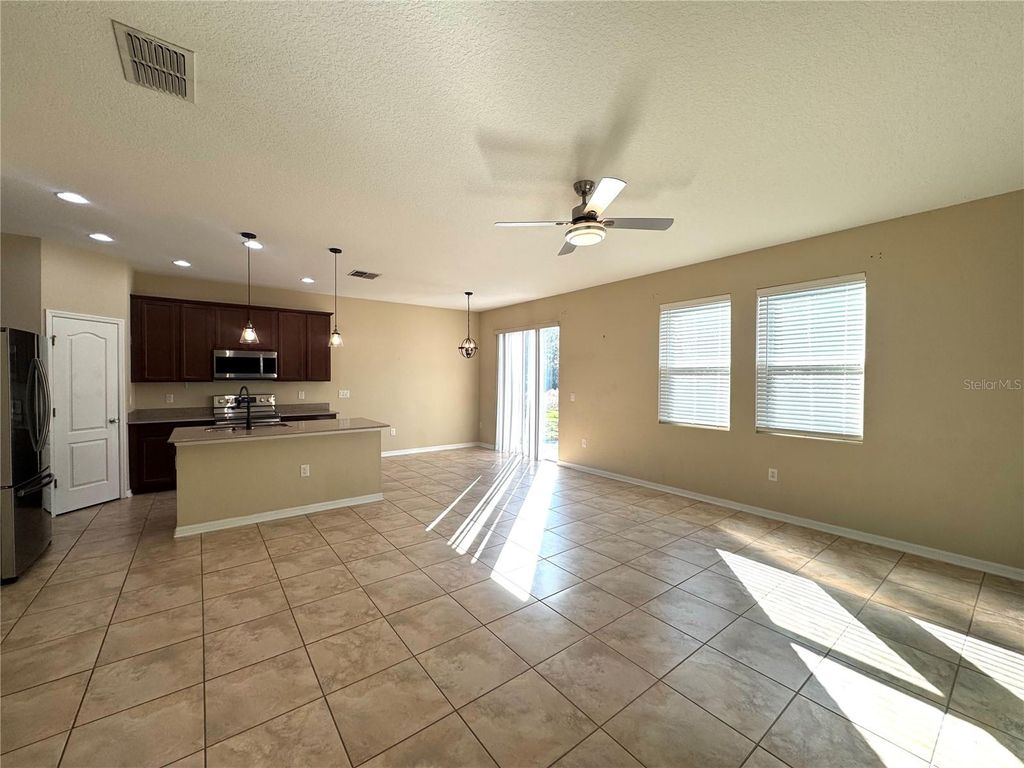 Photo of 215 Lakeshore Drive, Davenport, FL 33837 (MLS # O6375073)