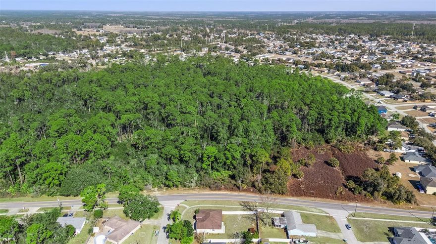 Enjoy the serenity of this 34-acre homesite opportunity located on Captain Drive in Deltona, Florida. This sizable property offers a chance to own a large tract of land in a growing yet peaceful area. With more than 1,000 feet of road frontage and a creek that winds through the property, the setting provides a naturally scenic and private environment. The parcel is zoned residential use, making it ideal for a private estate, future homesite, or long-term investment. Portion of the land consists of wetlands, creating possibilities for nature preservation, passive outdoor enjoyment, or environmentally mindful development, subject to proper planning and local approvals. Whether you envision a secluded retreat, conservation-focused use, or exploring responsible building options, this property provides a distinctive canvas