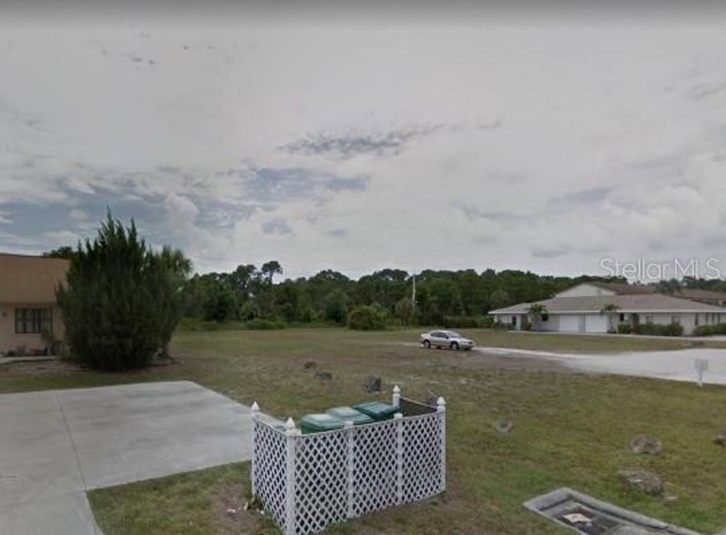 Photo of 71 Boundary Boulevard, Rotonda West, FL 33947 (MLS # O6383233)