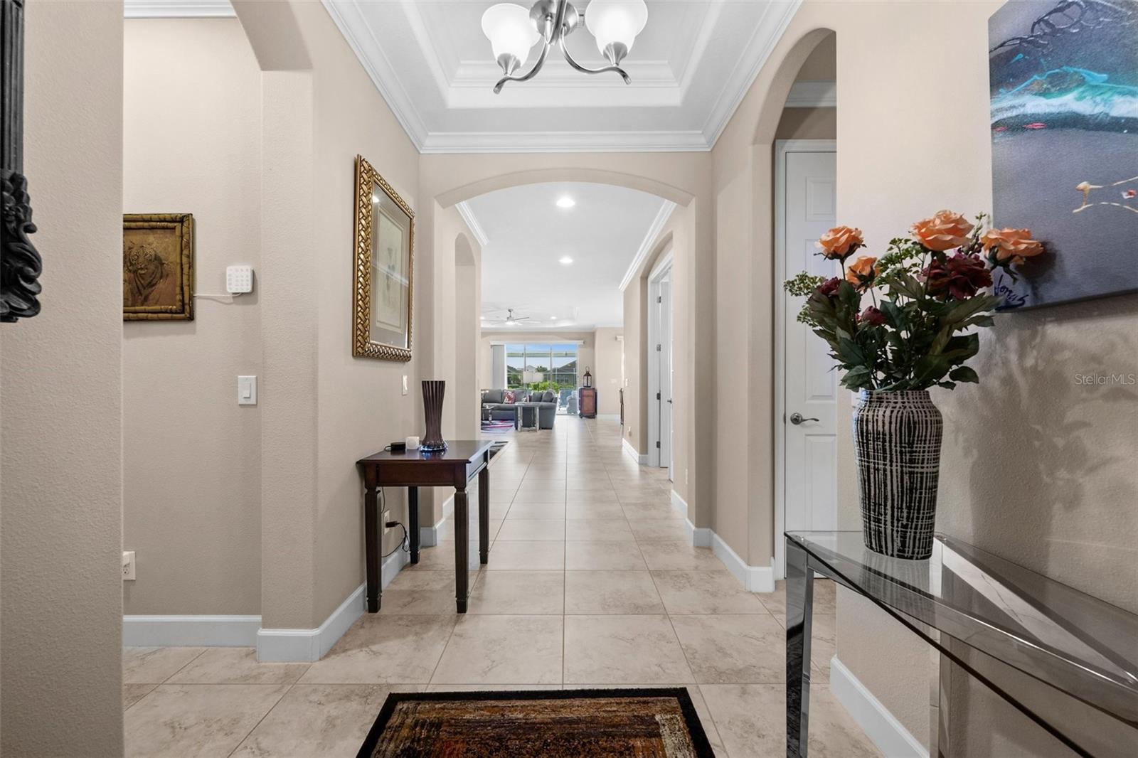 If you have an eye for quality, enjoying the finer things in life, this is the home for you. With an extensive list of upgrades, enhancements, and features, 2616 Malaita Court is a must see for the savvy buyer. Yes; you must see this polished gem to appreciate its beauty and value. The home has been meticulously maintained and exudes pride of ownership. Located in Cape Coral’s amenity-rich, resort-like community of Sandoval, this well-constructed, 3-bedroom, 3-bath, lakefront, pool home, with an outdoor kitchen, and den, offers the privacy and convenience of split bedrooms, including 2 master suites. The open floor plan is ideal for entertaining or for an active family. The bright and cheerful indoor kitchen showcases state-of-the-art GE Monogram stainless appliances, Samsung 2-door, 2-drawer Smart TV with Google Connect, granite countertops, double ovens, decorative tile backsplash, a 10-shelf pantry, light 46” cabinetry, Stainless Steel Chimney Range Hood, and numerous large, pull-out drawers. Soft-close? Of course. Additional Interior Features Include (not limited to): Glistening 24” and 20” Tile | 10’ Door Ways | Elegant Tray Ceilings | Crown Moldings & Base Moldings | French Doors | Modern Pendant Lighting & Light Fixtures | Additional High-Hat Custom Lighting | Modern Ceiling Fans with Remotes | Rounded Corners | Valances, Cornices & Bali Window Treatments | Fresh, Neutral Interior Paint | Massive Walk-In Shower with Multiple Shower Heads, Decorative Wall Tiles | Granite Countertops | Dual Sinks | Walk-In Master Closet Showcases Custom Built-In Cabinetry | Laundry Room Offers Upper & Lower Cabinetry, Sink & Granite Countertops | Large Hot Water Heater Additional Exterior Features Include (not limited to): Whole Home Generator Complete with 500 Gallon Buried Propane Tank | Electric Roll Down Hurricane Shutters | Accordion Shutters | Impact Windows | 26’ x 12’ Heated Saltwater, PebbleTec Pool with Dual Water Features | Outdoor Kitchen with Granite Countertop & Stainless Appliances | Oversized Lakefront, Pavered-Over-Concrete, Screened Lanai with Picture Window | Enhanced Landscaping | Oversized & Extended Freshly Painted Garage Enhanced with RaceDeck Flooring | Electric Car Charger | New Gutters & Downspouts Extended From Foundation | Plastic Valves Replaced with Metal Valves | Located at End of Cul-de-Sac The resort-style community of Sandoval Offers: Custom designed walk-in pool with special features, Bocce, Pickleball, Disk Golf, Shuffleboard, Horseshoes, Dog Parks (2), Playground, Volleyball, Basketball, Tennis, and Fishing Pier. Upon entering this community you will immediately know you are living the SW Florida lifestyle in a Tropical Resort.