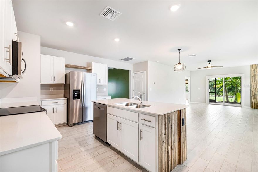 One or more photo(s) has been virtually staged. SELLER OFFERING 5,000 in CONCESSIONS towards CLOSING or interest RATE BUY-DOWN! Excellent income-producing opportunity, or home! Welcome to this stunning 3/2 home, in the highly sought-after Coral Bay community of North Fort Myers! 

This 3/2 thoughtfully upgraded home with custom, non-builder grade finishes truly sets it apart. Coral Bay is a brand new 2024 community offering an array of amenities, including a splash pad, playground, resort-style pool, lap pool, a fitness center, clubhouse, and courts for pickleball, bocce, and tennis. All with LOW HOA fees!!

 More about the home! *This home's backyard is not like other homes in this community!* This home's location is at the edge of Coral Bay, and the back yard is lined with thick bamboo palms providing wonderful privacy with NO REAR NEIGHBORS. It offers a serene tropical vibe just outside of the SCREENED-IN LANAI, with privacy provided by shady, landscaped banana palms. Also enjoy sunrise on your east-facing patio with coffee in hand! The open kitchen offers an island with custom WOOD FEATURES, and modern soft-close cabinets. The 3rd bedroom can serve just as that, or as a private dining room, office, or play-room. The master bedroom features vinyl PLANK FLOORING and a nice big window with BAMBOO BLINDS, and master bathroom features double sinks, a stall shower with shelving, a walk-in closet, and a separate toilet. 

*Additional Upgrades of the home done by owners* 
- SCREENED-IN PATIO 
- vinyl PLANK FLOORING in master bedroom 
- modern trim features throughout
- bamboo blinds in some of the rooms
- striking wood feature walls in the bathrooms, living room, and wrapped on the kitchen island
 - New MODERN CEILING FANS and LIGHTING, adding both style and comfort 
- beautifully landscaped grounds accented by lush banana palms.

Smart technology available for use: like video doorbell, Qolsys IQ Panel, Kwikset Home connect, Amazon Echo pop, Deako smart switch, and Honeywell t6 pro z-wave Thermostat.

Perfectly combining luxury upgrades with a vibrant, active lifestyle, this home won’t last long. 

Looking for an INCOME-PRODUCING PROPERTY? This home offers rental flexibility (30-day minimum, up to 4 leases per year), with steady rental potential and strong annual cash flow opportunities. Immediate move-in for any tenants. Great rental opportunity for long term tenants, or professional or transient tenants needing short term solutions! 30-day minimum, up to 4 leases per year.