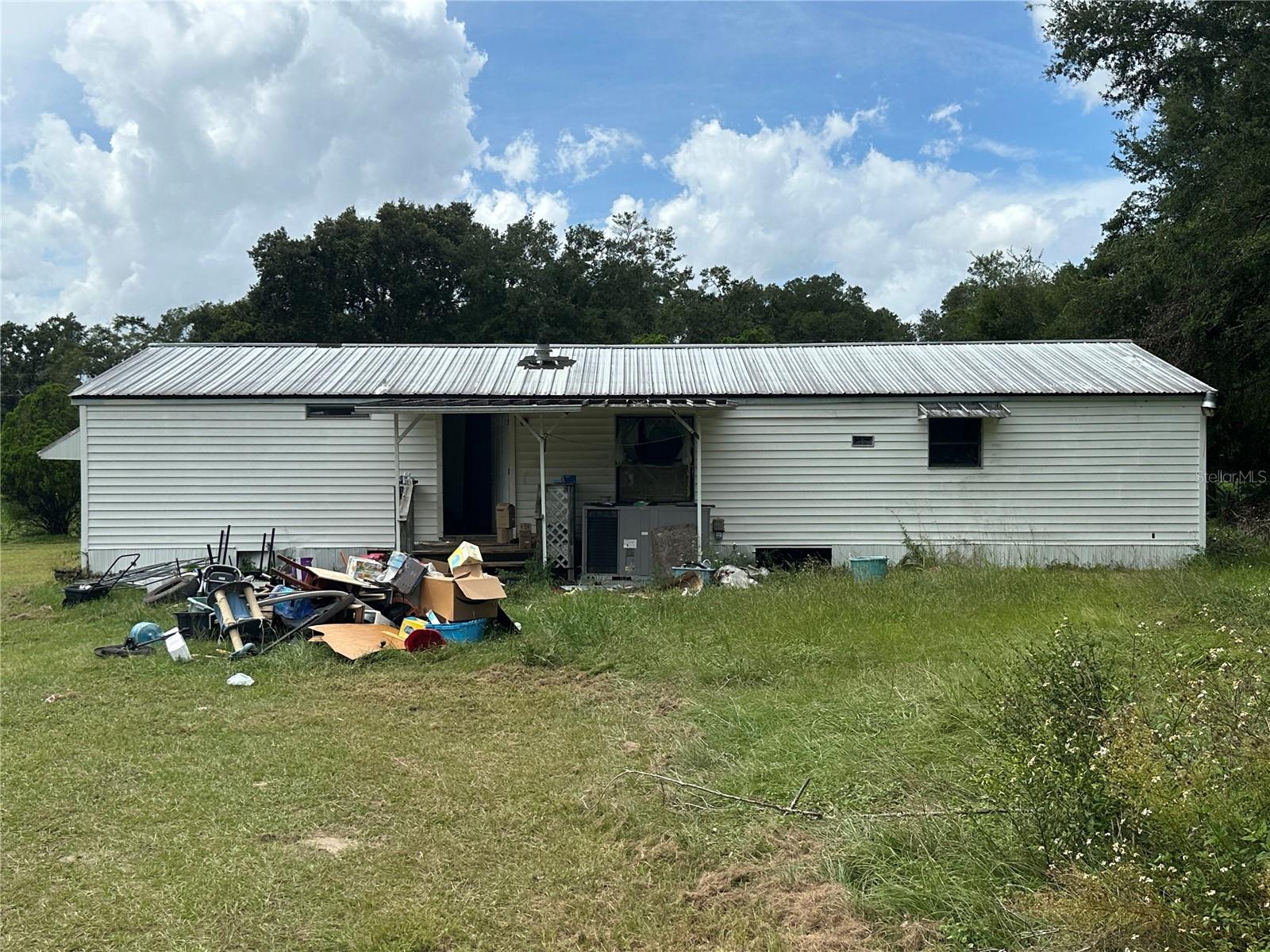 Opportunity Awaits in Umatilla – 2 Acres with Manufactured Home
Located 6 miles from Umatilla, FL, this property offers approximately 2 acres of land with mature trees and open space, providing plenty of potential for those seeking privacy or room for future projects. The parcel currently includes a manufactured home with three bedrooms and two baths that needs significant repairs, making it an ideal opportunity for investors, renovators, or buyers ready to customize a home to their vision.
With its spacious acreage, there is ample room for outdoor living, gardening, or adding additional structures. Conveniently located near the Florida Elks Youth Camp, the property is surrounded by the charm of the country and the natural beauty of Marion/Lake County. This prime location offers both convenience and seclusion—an excellent canvas for someone ready to create their own country retreat.