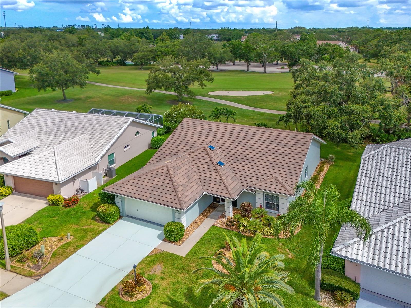 One of a kind, updated home in the private golf community, Tara GCC. Located on the 7th fairway of the the championship golf course, watch the golfers from your front row seat. Front screened porch greets you as you enter a light, bright open living area with triple sliders to the back lanai. Spectacular views of the Florida lush landscape and golf course. Vaulted ceilings with new fans. Separate dining room with new sparkling lighting. Eat-in kitchen with stone counters and loads of cabinets. Updated home has a newer flat tile roof 2017, freshly painted outside, AC 2019, new fans and brand new water heater. Split floor plan with 2 full baths. Home office has French doors and large windows. Sunny laundry room. Class A membership at Tara GCC, which is a private bundled community. 18 hole golf course, renovated recently with new tee boxes, fairways and greens. Tennis, har tru courts, Full Fitness center, Community pool, Bocce, New pickle ball facility with 5 courts (to open by September 2025), and an active Community clubhouse with grill room dining, special events and social activities for everyone. Clubhouse is being totally renovated 2025-2026. No assessments to the membership, no CCDs. The best bang for the buck in the Manatee county area for a private golf community. It is time for you to enjoy all Florida has to offer in the best run private community. Close to beaches, shopping, and great dining. Welcome to Taradise.