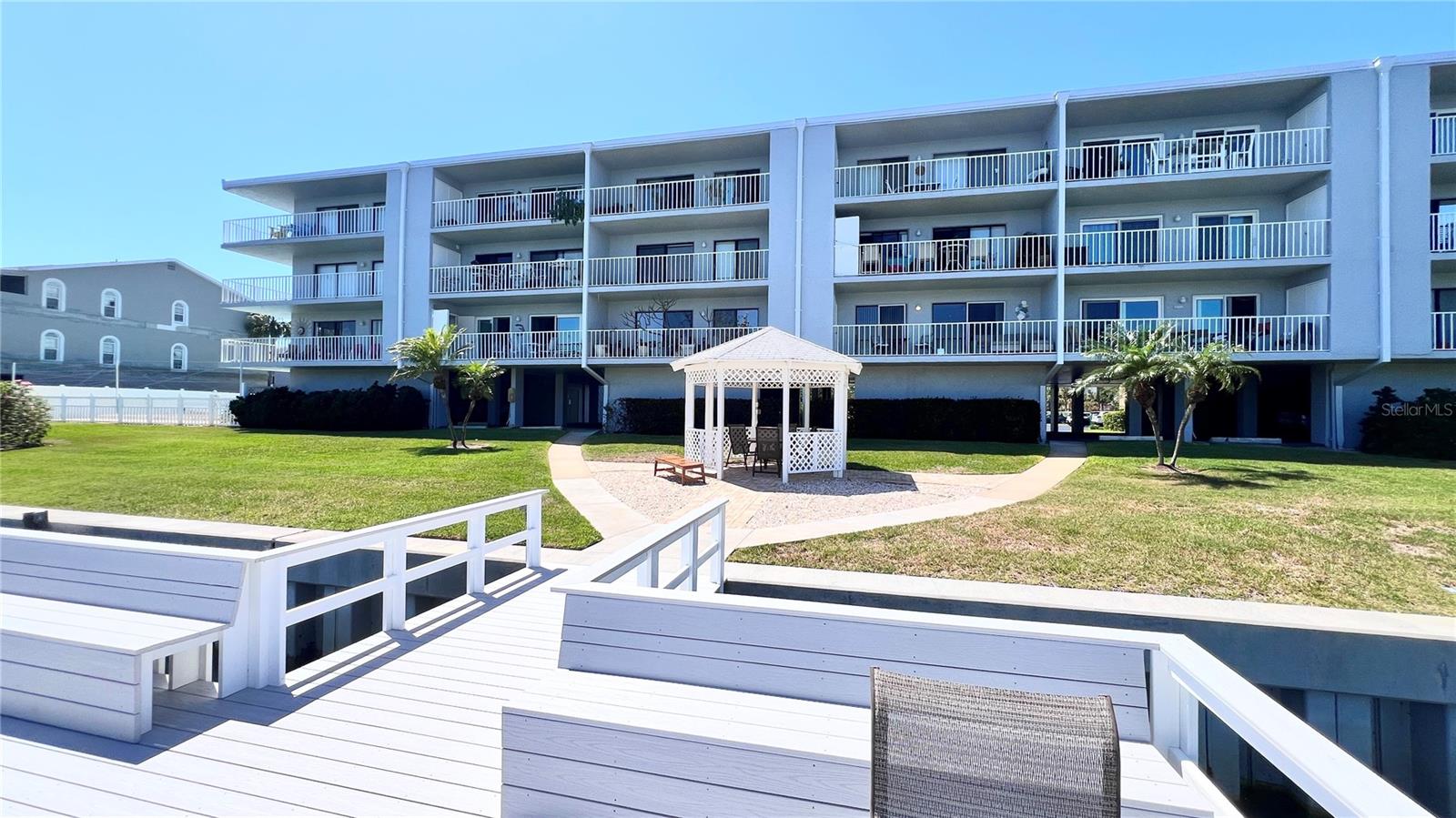 Another $10K PRICE IMPROVEMENT! Come on inside and take a peek at this gorgeous, maintenance- free condo that you can enjoy immediately. This turnkey, fully furnished 2 bed/2-bath features the best in luxury and comfort. The MILESTONE INSPECTION and SIRS (Structural Integrity Study) have been completed and the assessment for the newly installed roof has been Paid in Full! So if you're contemplating a great primary, secondary, or investment property, then consider this beautiful condo. The owners have spared no expense in making this a true showstopper. Located at Tierra 1, a waterfront community on exclusive Tierra Verde, this unit offers a generous open floor plan and an abundance of amenities and upgrades. It features an updated kitchen with stainless steel appliances, granite countertops and wood cabinets. With its neutral palette, the open living/dining room layout is spacious and light-filled. It features newer luxury vinyl flooring (2023) throughout the main living areas. The modern furniture and tasteful decor make it a perfect space for entertaining or relaxing. Off of the living room is an expansive patio that includes a convenient laundry closet with a new full sized washer & dryer. The spacious and private primary bedroom with updated en-suite includes a large walk-in closet and a walk-out balcony. The guest bedroom offers a comfortable and tranquil retreat, and an upgraded guest bathroom rounds out the space. This worry-free home means you can spend your free time enjoying and exploring the outdoor community amenities, including: a heated waterfront pool with spectacular views, a new dock, and a fishing pier. For the boating enthusiast, boat slips can be rented monthly ($80) through the Association. There is easy access to canals and the Intracoastal Waterway with no fixed bridges. Additional amenities include: an elevator, a community room, a hobby/tool room to for the weekend DIY warrior, kayak and bike storage, plus a newly refinished pickleball and tennis court. Maintenance fees include basic internet and cable package, water, sewer and trash. Peace of mind in your purchase includes a brand new HVAC system, 2019 water heater and updated electrical panel. If you enjoy an active lifestyle, this area is a perfect fit. It's a stones throw away from downtown Tierra Verde and nearby Ft. Desoto Park, renowned Gulf Beaches, marinas, shops, top-rated restaurants. A 10-15 minute drive puts you in the heart of vibrant downtown St. Petersburg. I-275 and U.S. Hwy 19 are less than 10 minutes away, and a 30-minute drive to Tampa International Airport. Come and enjoy this friendly community and active lifestyle!