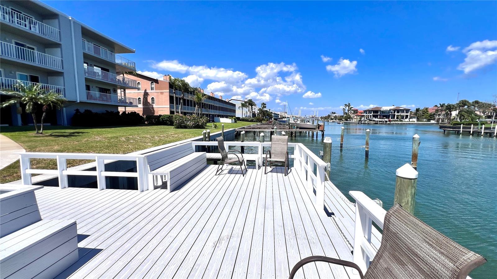 $10K PRICE IMPROVEMENT. Come on inside and take a peek at this gorgeous, maintenance- free condo that you can enjoy immediately. This turnkey, fully furnished 2 bed/2-bath features the best in luxury and comfort. The MILESTONE INSPECTION and SIRS (Structural Integrity Study) have been completed and the assessment for the newly installed roof has been Paid in Full! So if you're contemplating a great primary, secondary, or investment property, then consider this beautiful condo. The owners have spared no expense in making this a true showstopper. Located at Tierra 1, a waterfront community on exclusive Tierra Verde, this unit offers a generous open floor plan and an abundance of amenities and upgrades. It features an updated kitchen with stainless steel appliances, granite countertops and wood cabinets. With its neutral palette, the open living/dining room layout is spacious and light-filled. It features newer luxury vinyl flooring (2023) throughout the main living areas. The modern furniture and tasteful decor make it a perfect space for entertaining or relaxing. Off of the living room is an expansive patio that includes a convenient laundry closet with a new full sized washer & dryer. The spacious and private primary bedroom with updated en-suite includes a large walk-in closet and a walk-out balcony. The guest bedroom offers a comfortable and tranquil retreat, and an upgraded guest bathroom rounds out the space. This worry-free home means you can spend your free time enjoying and exploring the outdoor community amenities, including: a heated waterfront pool with spectacular views, a new dock, and a fishing pier. For the boating enthusiast, boat slips can be rented monthly ($80) through the Association. There is easy access to canals and the Intracoastal Waterway with no fixed bridges. Additional amenities include: an elevator, a community room, a hobby/tool room to for the weekend DIY warrior, kayak and bike storage, plus a newly refinished pickleball and tennis court. Maintenance fees include basic internet and cable package, water, sewer and trash. Peace of mind in your purchase includes a brand new HVAC system, 2019 water heater and updated electrical panel. If you enjoy an active lifestyle, this area is a perfect fit. It's a stones throw away from downtown Tierra Verde and nearby Ft. Desoto Park, renowned Gulf Beaches, marinas, shops, top-rated restaurants. A 10-15 minute drive puts you in the heart of vibrant downtown St. Petersburg. I-275 and U.S. Hwy 19 are less than 10 minutes away, and a 30-minute drive to Tampa International Airport. Come and enjoy this friendly community and active lifestyle! Sellers will pay $5000 towards buyer's closing costs with FULL PRICE OFFER.