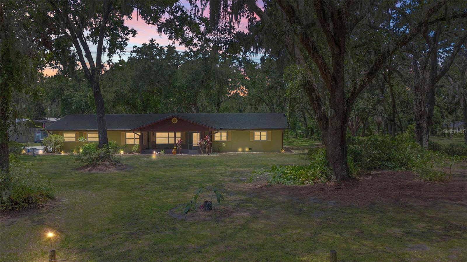 Modern Comfort Meets Country Freedom – 2.29-Acre Fenced Property with Workshop & RV Setup.
Discover the perfect blend of modern updates and open space on this fully fenced 2.29-acre property. This well-maintained 3-bedroom, 2.5-bath home features a versatile bonus room, tile flooring throughout, and a beautifully renovated kitchen with soft-close cabinets, granite countertops, and brand-new appliances.
The spacious primary suite, along with two additional bedrooms, provides comfortable and functional living. A convenient half bath is located in the attached two-car garage—great for cleaning up after outdoor projects or work in the shop.
For those needing extra space, the property includes a 50' x 60' metal workshop with durable steel beams, large loft for extra storage, two 14-foot roll-up doors, and a drive-through layout—ideal for storing equipment, tools, or recreational vehicles. The workshop is equipped with both 30-amp and 50-amp hookups to support a variety of power needs.
An oversized 20' x 35' RV carport adds even more flexibility for storage or travel-ready living. The 14' x 24' pump house shelters a private well and water system, and a built-in brick barbecue area nestled under mature shade trees offer plenty of room to relax or entertain outdoors.
No HOA means more freedom and flexibility for how you use your land. Whether you're into hobbies, home-based business, or just want room to grow—this property is ready for it all. Buyers must verify all information and measurements.