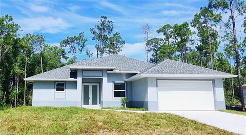 Photo of 111 Monroe Avenue, Lehigh Acres, FL 33936 (MLS # A4642319)