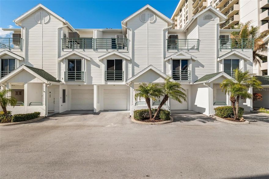 Welcome to Cutter Cove, just minutes from world-famous Clearwater Beach. This spacious FURNISHED 3-bedroom, 3-bathroom townhome offering approximately 1,700 sq ft combines coastal living with thoughtful updates and incredible pool views. The oversized 2–3 car tandem garage provides abundant storage and includes an additional parking space directly in front of the unit. French doors from the garage open to a covered patio for convenient outdoor living.

The second level features a renovated kitchen with refinished oak cabinets and granite countertops, plus a bedroom, full bathroom, dining area, and living room with engineered wood flooring. Sliding glass doors lead to the first of two balconies overlooking the heated community pool, complete with tiki huts, BBQ areas, and lounge seating. Notably, this is the only building in the community with direct pool views.

On the third level, you’ll find the second bedroom with en-suite bath, the primary suite with walk-in closet, dual vanity bathroom, and private balcony overlooking the pool, plus the laundry room. A spiral staircase in the primary bedroom leads to a large loft, ideal for a home office or flex space.

Recent improvements include a 2020 Trane HVAC system, new electrical panel (2019), and bathroom renovations in 2016 with updated vanities, sinks, and countertops. The staircase has also been upgraded with wrought-iron balusters. HOA improvements include new roofs in 2024 and building tenting in 2025. Located about 1.5 miles to Clearwater Beach, with easy access by car, bike, or nearby trolley, and close to shopping, dining, and the Clearwater Marine Aquarium. Dishes & kitchenware, personal decor, workout equipment, traeger, and TVs excluded from sale.