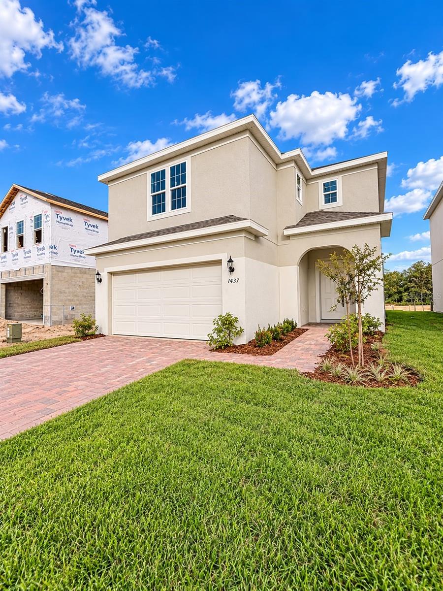 Photo of 1437 Sawgrass Hammock Lane, Davenport, FL 33837 (MLS # O6445549)