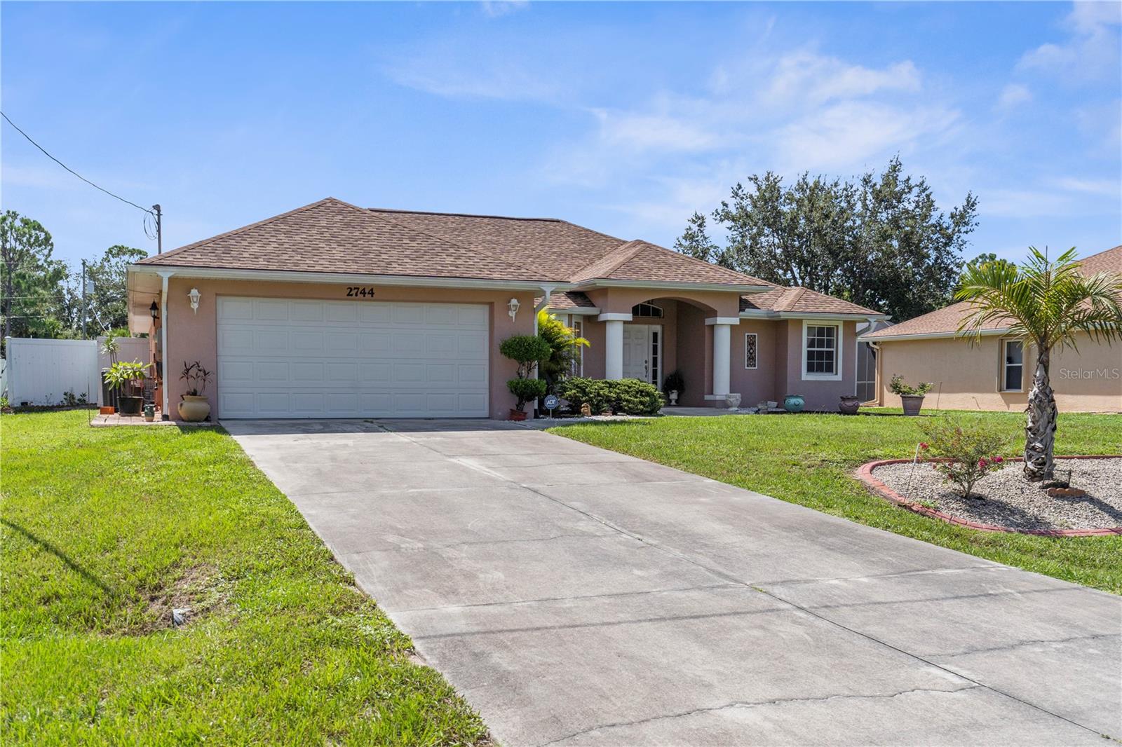 Welcome to your Florida oasis! This beautifully maintained 3-bedroom, 2-bathroom, 2,227 sq. ft. home with a split floor plan offers the perfect blend of comfort, functionality, and style. Nestled on a spacious lot in North Port, this property is being offered along with the adjacent lot, providing additional space, privacy, or the opportunity to build in the future.
Inside, the home features two large living areas—a formal living room with soaring ceilings and a cozy family room off the kitchen—perfect for entertaining or relaxing. The bright, open kitchen is complete with a breakfast bar, ample cabinet space, and a breakfast nook overlooking the backyard. A formal dining room with a large picture window adds charm and is the perfect setting for family meals or gatherings.
The private owner’s suite includes tray ceilings, French doors to the lanai, two walk-in closets, and a spacious ensuite bathroom with dual sinks, a soaking tub, and a separate shower. Two additional bedrooms with generous closets and a full guest bath provide comfortable accommodations for family or guests.
Step outside to the screened-in lanai and extended patio, ideal for year-round Florida living. The backyard is fully fenced, landscaped, and even includes a utility shed for additional storage. Throughout the home you’ll notice the airy vaulted ceilings, tile flooring in the main living areas, a dedicated laundry room with storage, and an attached two-car garage.
Situated in a quiet neighborhood, yet conveniently close to shopping, dining, I-75, and only a short drive to the beautiful Gulf beaches, this home offers both peace and accessibility. With 2,887 total sq. ft. and the rare bonus of an extra lot included, this property truly stands out as a unique opportunity in North Port. Schedule your private showing today!