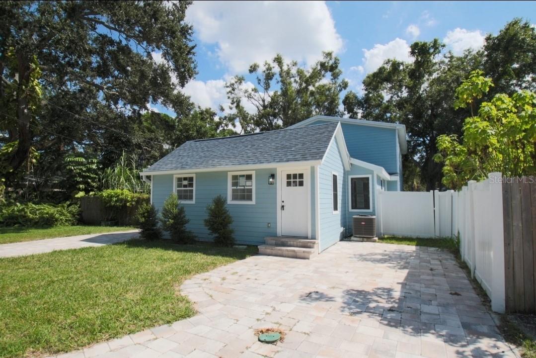 Welcome to your fully updated dream home in the heart of Pinellas Park! This spacious 4-bedroom, 3-bathroom residence has been completely renovated inside and out, offering the perfect blend of style, comfort, and peace of mind. The brand-new kitchen is a true showstopper, featuring all new cabinetry, modern appliances, and a striking waterfall quartz island that makes the perfect centerpiece for both cooking and entertaining. Inside, you’ll also find all-new plumbing, electrical, recessed lighting throughout, and elegant new LVP flooring that flows seamlessly across the home. There are two master suites, one with a private walk-out balcony, and all three bathrooms have been fully remodeled with fresh, modern finishes. The exterior is equally impressive with a brand-new roof, brand new durable Hardie board siding, several new windows, and a newly built balcony. A new double paver driveway provides plenty of parking, while the gated backyard offers secure storage for a boat or RV. The brand-new fence and gates enclose a small, low-maintenance yard perfect for outdoor enjoyment. Additional highlights include new lighting fixtures and hardware throughout, Flood Zone X! Requires NO flood insurance, and proven storm resilience, having withstood two recent hurricanes without damage or flooding. With every major system updated, this turnkey property delivers modern upgrades, functionality, and peace of mind—all just minutes from shopping, dining, schools, and Florida’s world-class beaches.