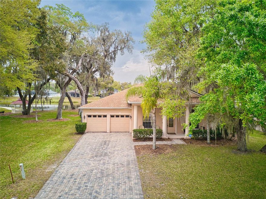 WELCOME HOME to Oak Hammock Preserve! This recently updated home features a large open-concept floor plan that includes separate formal dining and living room areas! As you enter, you are greeted by a large entryway with tall ceilings and a view of the large pool and water views! The footprint of the home offers split-bedroom design with the owner's retreat and three secondary bedrooms on opposite sides of the home. The kitchen and great room combination offers an excellent space to gather, along with large sliding doors that lead you to the lanai and huge outdoor space. Enjoy the pool and spa, surrounded by large hardscaped spaces the completely surround it, offering a nice space to enjoy the water views directly behind the home. Large trees surround the home, giving natural shaded spaces that invite you to enjoy this home both inside and out. Come see it today!
