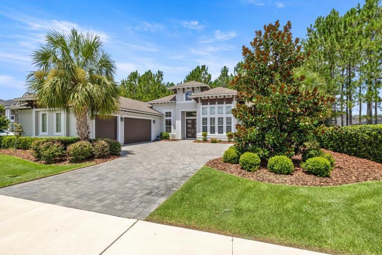Sellers are offering $12,500 towards buyers' closing costs and prepaid's. Discover the perfect blend of comfort, style, and convenience in this beautifully maintained home nestled in one of the most desirable neighborhoods. This residence offers an inviting floor plan designed for modern living, featuring spacious living and dining areas filled with natural light, complemented by tasteful finishes throughout. The heart of the home is an open kitchen that seamlessly flows into the family room, anchored by a large center island perfect for gatherings. Enjoy a walk-in pantry cleverly hidden behind cabinet doors, stainless steel appliances, including a wall-stacked oven and microwave, gas stove top, stainless steel exhaust hood, and a tumbled marble backsplash that adds timeless style. Soaring 12-foot ceilings in the main living areas and a striking 13-foot ceiling in the light-filled office/flex room enhance the spacious feeling throughout. Luxurious primary suite featuring remotely controlled blinds, dual walk-in closets, and a spa-inspired bathroom with an elegant free-standing tub set in a wet room, a walk-in shower, dual vanities, abundant custom cabinetry, and a tranquil flex space. Three additional large bedrooms are arranged for maximum privacy: two share a beautifully appointed guest bath, and the fourth bedroom enjoys its private bath that can be closed off for guest or multigenerational living. Step through 10-foot sliding glass doors onto an inviting screened-in lanai with pavers. Completed with a summer kitchen-including sink, refrigerator, grill, and built-in speakers-perfect for entertaining family and friends. Relax while you take in the serene views of the lush green space behind the home. Thoughtful upgrades and finishes: Granite counter tops, wood plank tile in all the common areas, upgraded lighting, designer light switches, central vacuum system, alarm system, and internet wired throughout, gutters, irrigation system, and a spacious three-car garage. Don't miss out on this Oakmont lifestyle, where everyday living feels like a vacation. Residences enjoy the resort-style amenities: community pool, fitness center, tennis courts, playgrounds, trails, and clubhouse. This home offers easy access to the top-rated schools, shopping, dining, and medical centers, the Town of Tioga, Haile town center, The University of Florida, UF Health, VA Hospitals, and HCA Hospital, close to I-75, with both comfort and convenience. This home is more than just a place to live-it's where every detail has been crafted to elevate daily living.