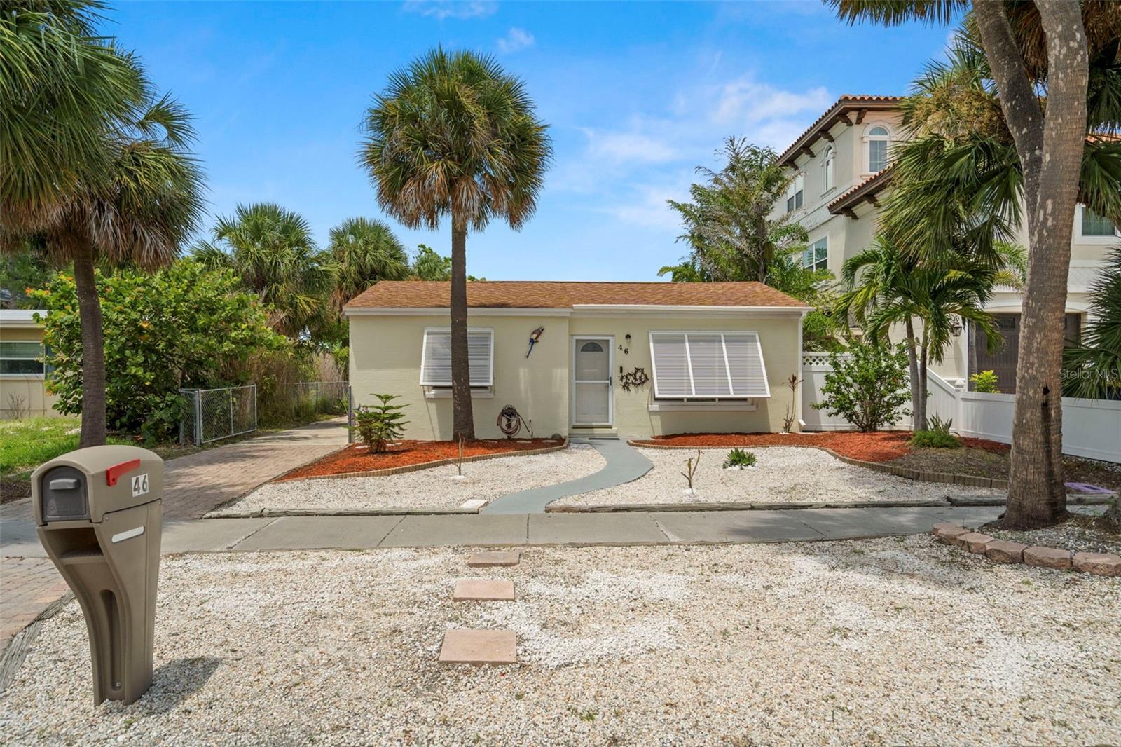 Welcome to your perfect beach home! Freshly renovated and move in ready. Ideally set in one of the most desired areas in Clearwater Beach. The home features two bedrooms, one and one half bathrooms, and a screened in deck. Plenty of room to park with an expansive carport and a large garage. This is a very special home and a great offering.