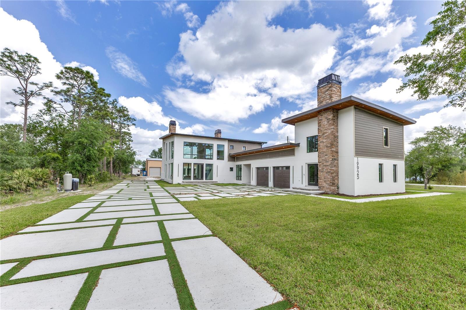 Under Construction. Under Construction – Exceptional Private Estate on 1.79 Acres | A Rare Multi-Generational Sanctuary
Step into a world of refined luxury and effortless living with this extraordinary under-construction estate, thoughtfully designed as a private, multi-generational compound. Nestled on 1.79 secluded acres, this rare offering combines architectural elegance with unparalleled functionality—perfect for extended families, discerning entertainers, or those seeking a live/work retreat of the highest caliber.
The expansive property includes a masterfully crafted main residence, a fully appointed one-bedroom guest house, a resort-style pool house with half bath, and an impressive 2,490 sq ft RED IRON structure with five oversized bays, full kitchen and bath, and an additional 1,000 sq ft of customizable loft space—ideal for a private studio, professional-grade gym, office, or luxurious guest accommodations.
Inside the main home, luxurious design meets modern comfort. Featuring 3 bedrooms, 2.5 bathrooms, a dedicated office, mudroom, and spacious loft, every inch is curated with high-end finishes including exquisite wood flooring, Taj Mahal quartz countertops, soaring ceilings, and expansive windows that flood the home with natural light. The chef’s kitchen is a showstopper, equipped with Bertazzoni appliances, a professional gas range, and sleek custom cabinetry - making everyday living and entertaining effortless.
The lavish primary suite is a sanctuary of peace and indulgence, offering a spa-inspired bathroom, an expansive walk-in closet, and upscale touches that elevate daily routines. Enhancing the ambiance, both the main and guest houses feature central vacuum systems and an integrated Aroma360 HVAC scenting system, creating a truly immersive sensory experience from the moment you arrive.
The guest house offers a private entrance, full kitchen, living area, one bedroom, and one bathroom—ideal for in-laws, guests, or as a private rental opportunity.
The pool house offers endless versatility, with room to tailor it into a secondary guest suite, a wellness retreat, or a luxurious lounge area.
One of the estate’s most remarkable highlights is the 2,600+ sq ft RED IRON garage, boasting five full bays, soaring ceilings, and the potential to build a full two-story living space. Whether envisioned as a car enthusiast’s dream, art studio, man cave, or full guest quarters, this structure redefines what’s possible in private estate living.
In total, the estate spans over 6,300 square feet across all structures—offering a rare blend of space, elegance, and endless possibility. Quietly tucked away yet close to everyday conveniences, this is a once-in-a-lifetime opportunity to own a truly iconic property designed for luxury, flexibility, and generational legacy.