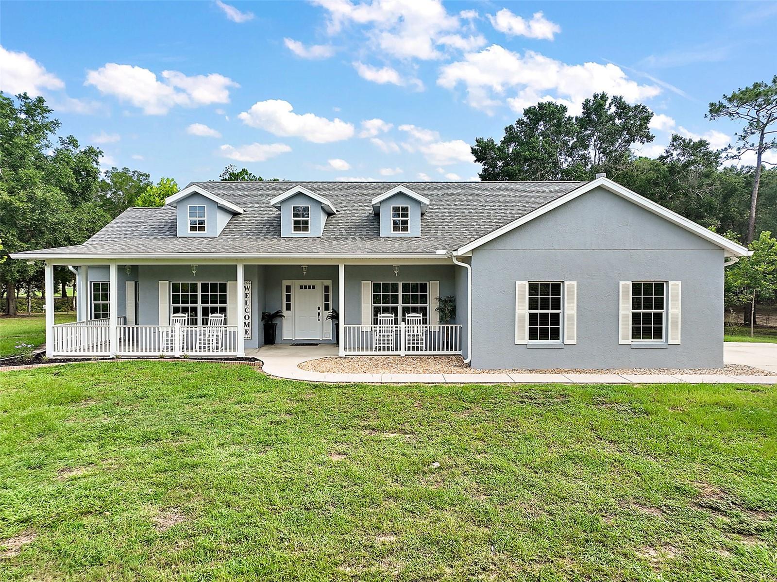 TURN KEY, JUST BRING YOUR TOOTHBRUSH. This solid concrete block (poured walls) home has 3 bedrooms, 2 baths, an office (4th bedroom?), a screened back porch and outside patio, finished oversize garage on 5 beautiful fenced acres. there is also a ''tiny'' house for guests or grandparents, a large workshop with all tools included, and a state of the are kennel. The property is completely fenced with vinyl coated chain link and an electric gate. The home has been completely upgraded in the last year. Everything is new including all appliances, fixtures, porcelain tile floors through out, rainforest bathrooms, top of the line kitchen. Roof and air are 3 yrs old. A generator and a 500 gallon gas tank will handle the home and all outside buildings when needed . The kennel is a Morton building, completely finished inside with 15 4 x 8 inside runs connected with 4 x 20 outside,shaded runs and a 8 x 16 puppy area opening to a 15 x 20 outdoor space. Inside is a grooming area and wash station. The kennel has its own air conditioner, bathroom, hot water heater, washer, dryer, dehumidifiers, and drainage system. The inside kennels are all stainless steel with see through front panels. There are also 5 large exercise paddocks . The property is surrounded by local horse farms and is 15 miles from Florida Horse Park where multiple dogs shows are held throughout the year. The home is being sold with all furnishings, tools, secuirity system and starlink, with all furnishings, tools, security system and starlink,