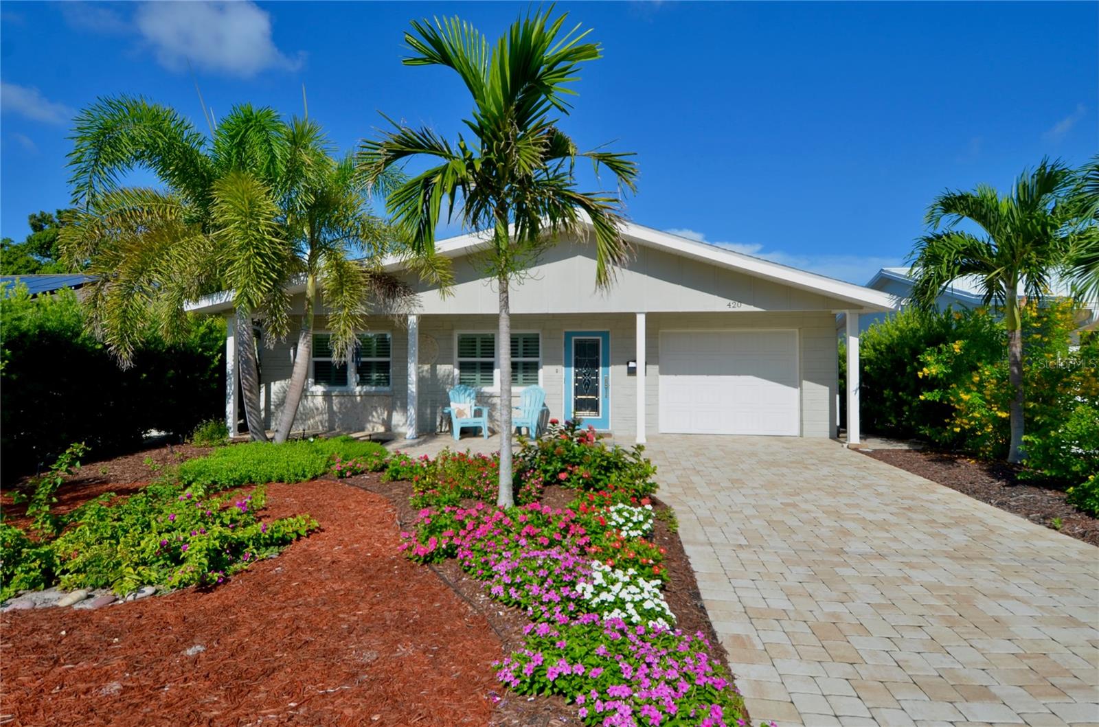 Charming Venice Island Home! Welcome to this tastefully updated 2 bed, 1 bath home located in the heart of Venice Island. With its open floor plan, modern updates, and inviting backyard retreat, this home combines comfort, functionality, and island charm. Enter into an open-concept living space, where the living room seamlessly flows into the kitchen. A large breakfast bar with built-in storage serves as the perfect centerpiece, defining the space while keeping it airy and connected. The kitchen is striking, featuring white shaker cabinets, contrasting black granite countertops, stylish subway tile backsplash, and stainless steel appliances. Also, recessed lighting, a pantry cabinet, and abundant storage make it both practical and appealing. Just off the kitchen is a versatile space, model for a cozy dining nook, sitting room, or even a home office. Both bedrooms are sizable with built-in closets, sharing the home's updated bathroom. The bath has a walk-in shower with cut-out shelving and a bench seat, a granite-topped vanity with sufficient storage, and a mirrored medicine cabinet for added convenience. At the back of the home, enjoy the enclosed lanai with panoramic windows, offering stunning views of the backyard retreat. The outdoor space is ideal for entertaining or relaxing, with an extensive pavered patio for grilling, dining, or sunbathing. Beyond the patio, an enchanting archway leads into beautiful landscaping and garden areas. Additional home highlights include: tile flooring throughout, crown molding, concealed laundry closet, linen closet for extra storage, impact windows, plantation shutters, unique stone detailing on home's front exterior, and well-maintained front landscaping for an impressive curb appeal. Home is located half a mile from Downtown Venice, and less than two miles from multiple Gulf beaches. It is also in close proximity to Blalock Park, Venice Community Center, Venice Public Library, Venice Museum, Venice Theatre, Sarasota Memorial Hospital branches, golf courses, Legacy Trail, Venice Art Center, and the Venice Performing Arts Center, and many other appealing destinations. This adorable Venice Island home is the perfect blend of modern updates and cozy charm—all within minutes of Venice’s beaches, dining, and historic downtown. Don't miss the opportunity to experience the epitome of the Island Lifestyle!