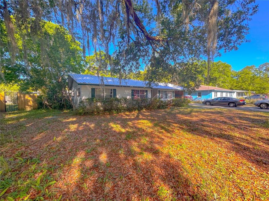 Home on a larger lot with plenty of storage in the heart of downtown Gainesville! This 3 bedroom 1.5 bath home is walking/biking distance to schools and downtown bars and restaurant's. Home features a large great room that flows into a spacious and modern kitchen. All bedrooms are well sized. Large back porch that overlooks a large yard with storage shed. Laundry hookups available! 2 pets welcome. Students welcome.