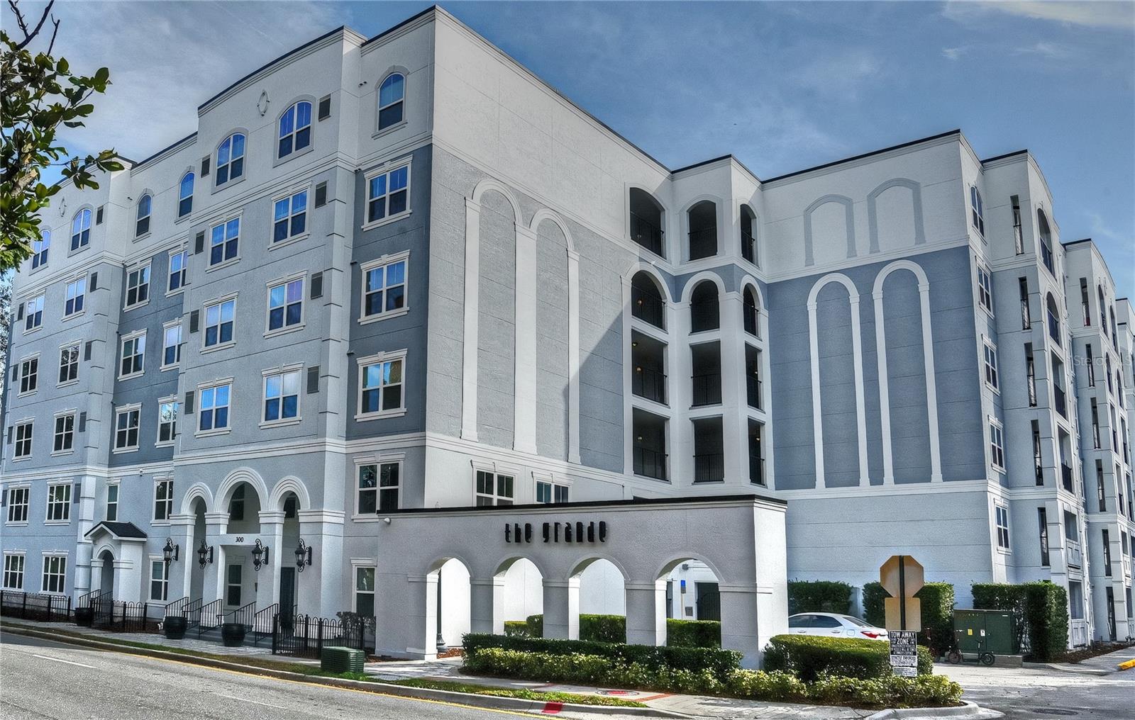 Location truly is everything in real estate, and The Grande offers one of the best addresses in downtown Orlando.
This 4th-floor condo (Unit #4027) features beautiful treetop views and an unbeatable location. The Grande, a desirable mid-rise community, sits at the corner of South and Rosalind—directly across from the Dr. Phillips Center for the Performing Arts.
From here, you’re just minutes to popular restaurants, retail shopping, Publix, Starbucks, Orlando’s SunRail, Amway Center, and some of the city’s most beautiful parks, including Lake Eola, Orlando’s signature downtown park.
Inside, the condo features upgraded wood laminate flooring, a fully equipped kitchen with range, refrigerator, dishwasher, and disposal, plus a full-size washer and dryer.
The Grande offers fantastic amenities, including a resort-style pool with expansive sun deck and tiki bar and fitness center. This unit also comes with an assigned parking space (#84) on the 2nd floor.