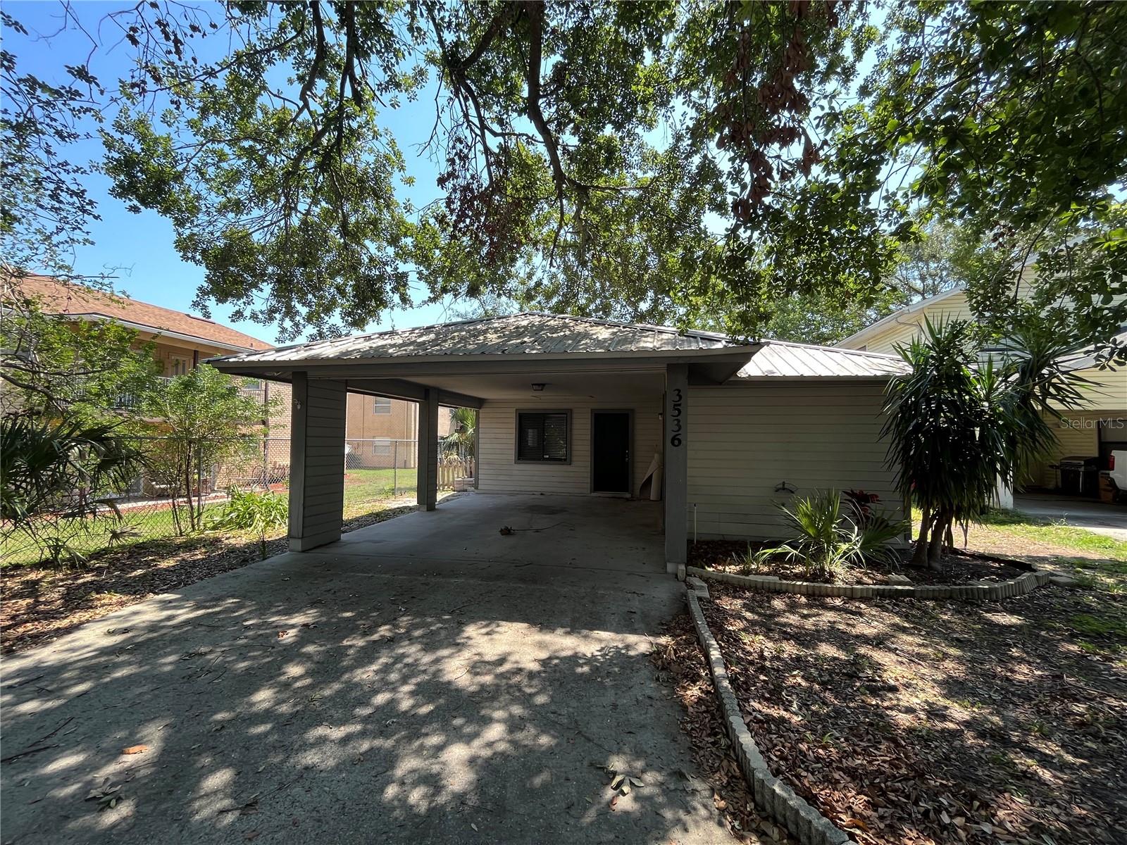 This cute 2 bedroom 2 bath single family home is tucked away in a small neighborhood located off of Cleveland Heights Blvd. This home is just minutes from the Polk parkway and Downtown Lakeland. This home has a fenced in yard and is walking distance from the local YMCA!