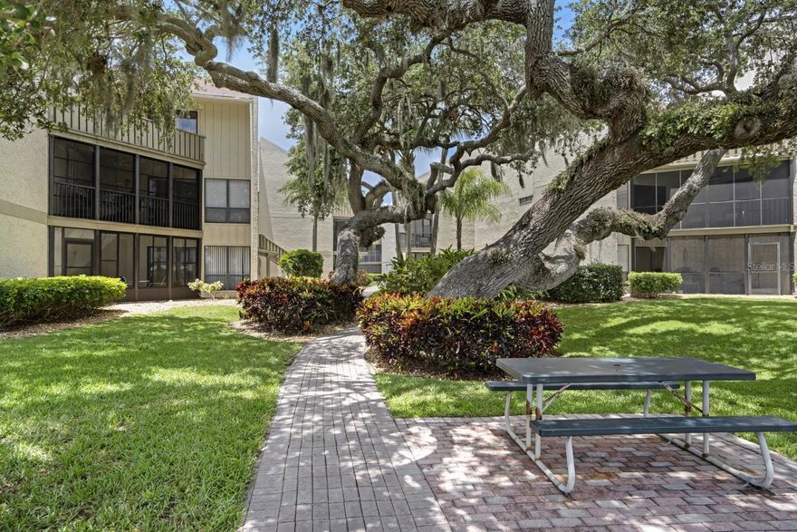 BEAUTIFUL 1 BEDROOM 1 BATH UNIT IN BAY OAKS on SIESTA KEY ** TURNKEY FURNISHED ** 1 WEEK RENTALS ALLOWED ** The waves crash, the sand is sugar-coated and the sunsets are striking on Siesta Key.. There is no better location to invest in a 2nd home or investment property. This condo is located on the 2nd floor of building E in Bay Oaks. You will love the large open kitchen and expansive design of this "Santa Fe" themed unit. Located at the end of the 2nd floor in a corner of the building, privacy and tree lined views from the patio create serenity for the owner and tenants. Boasting 750ft2 of living area, there is no wasted space with eat-in dining and wide-open family space. The master bedroom is also open & airy with an on-suite vanity and large walk-in closet, including a washer/dryer. Bay oaks is located just north of the Stickney point bridge allowing more quick escape off the island to Publix, Bealls, Starbucks and Gulf Gate shopping. The community provides a wonderful community pool and tennis court with a full-time manager on site. Beach access 12 is the best public access to the white sands of Siesta Key or catch the Trolley and enjoy and scenic ride to the public beach. Now is the time to invest in Siesta Key real estate.