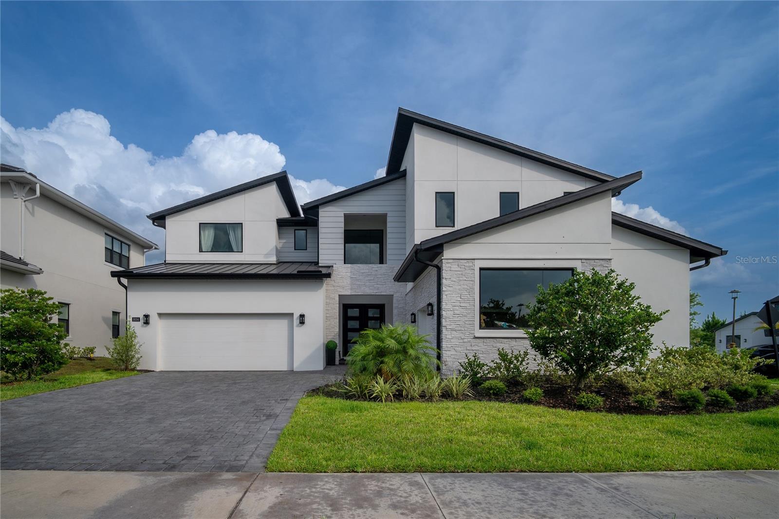 Experience modern luxury in Laurel Pointe at Lake Nona, one of Orlando’s most sought-after gated communities. This 2023 contemporary corner-lot masterpiece combines elegance, comfort, and innovation with immediate access to everything that defines Lake Nona, including the world-renowned Medical City, leading research and health institutions, the U.S. Tennis Association National Campus, top-rated schools, and a thriving cultural, dining, and business scene.
Designed for today’s lifestyle, the home features 4 en-suite bedrooms, 4.5 baths, and a private study/home office. The gourmet kitchen with premium appliances, quartz countertops, center island, and walk-in pantry anchors the living space, while the owner’s suite provides a spa-inspired retreat with freestanding tub, rainfall shower, and dual walk-in closets.
High ceilings, abundant natural light, and refined finishes flow throughout. A highlight of this residence is its spacious corner lot backyard, perfect for social gatherings or private relaxation, with room to design your own pool or custom outdoor living space. Additional features include a 3-car garage and integrated sound system.
Living in Laurel Pointe means enjoying resort-style amenities: pool, fitness center, parks, and 40+ miles of interconnected trails, all minutes from Orlando International Airport.
This is more than a home; it is your opportunity to own a piece of Lake Nona’s future and experience the lifestyle that has made this community one of the most innovative and desirable in the nation.