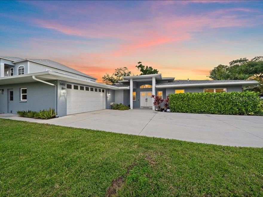 Looking for a home with boating access in your backyard, yet still mainland and close to everything you need? Welcome to 2492 Waterview Ct in Sarasota! This home was substantially renovated in 2024 and offers 3 bedrooms, 2 bathrooms, 2 car garage, pool, and dock with 4,500 lb boat lift on Phillippi Creek. You'll have peace of mind with a 2023 roof, all impact windows and doors, and knowing this home had no water intrusion from any recent storms. Entering the home from the double front entry door, you'll be impressed with premium grade white oak engineered hardwood flooring throughout the home, high ceilings, new baseboards, trim, interior doors, and tons of natural light shining in. A spacious living room and dining room combination offers separation between your primary suite and spare bedrooms. The kitchen has quartz countertops, tons of cabinetry, a large pantry, and an eat in area perfect for a breakfast table or banquet. Enjoy subtle water views from your primary bedroom featuring a completely renovated ensuite bath with marble countertops, dual sinks, jet tub, frameless glass shower, water closet, and walk-in closet with custom built in shelving. On the other side of the home, you'll find a hallway with storage closet, a full bathroom with dual sinks and a shower/tub combination, along with two spare bedrooms - each housing dual closets with custom shelving. A laundry room with sink and cabinetry is located off the kitchen near the garage entry. Both areas of the main living space offer sliding glass doors leading out to a spacious patio and open-air pool that was completed in 2020. The fully fenced yard is perfect for pets, kids, and privacy. Walk through your backyard down to the creek and find a private boat dock with lift ready for you to enjoy countless days out on the beautiful waters surrounding Sarasota with just a quick boat ride to get to the main channel. You'll enjoy summer nights with the lively atmosphere and vibes of the Phillippi Creek boating community with your neighbors out and about on the water. The two-car garage has plenty of cabinetry for storage, along with a separate room plumbed for a full bath or whatever you want to make of it to suit your needs. Enjoy the privacy of this 1/3 acre lot knowing you'll never have a neighbor to the left side due to a large grassy retention pond area. Riverview Manor has very low HOA dues coming in at only $450 per year. You are minutes from the Landings shopping plaza and everything 41 has to offer, as well as less than 10 minutes to the North or South Bridge to Siesta Key, and less than 15 minutes to Downtown Sarasota. With water access, a boat lift and dock, renovated home, pool, and prime location, there is not much more you could be looking for! Schedule your showing today.