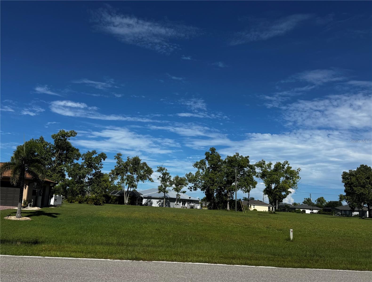 Nestled within the serene and well-kept surroundings of Burnt Store Village , 25872 Prada Drive presents an exceptional opportunity to build your dream home—or perhaps a strategic investment in a sought-after Southwest Florida locale.
This generous 9,440 sq ft level lot offers ample room for a spacious custom residence, complete with room for a pool, garage, lush landscaping, or any personal design touches you envision. Backed by a homeowners association, the neighborhood maintains aesthetic and structural consistency—ensuring your new build will complement nearby properties and benefit from community standards.
Location Highlights:
Deed-restricted neighborhood, offering a peaceful and polished community environment.
Minimal ongoing costs—modest HOA fees and low property taxes—help make development or holding inexpensive.
Ideal setting for those seeking tranquil living with convenient proximity to Punta Gorda’s amenities, marinas, parks, golf courses, and charming downtown waterfront. Punta Gorda is known for its revitalized Harborwalk, linear parks, and pedestrian-friendly trails, all fostering a welcoming coastal lifestyle.
Whether you’re planning to build right away or hold for future appreciation, this lot embodies both flexibility and potential. Create your ideal home base in a coveted neighborhood—where tranquil residential living and Southwest Florida charm converge.