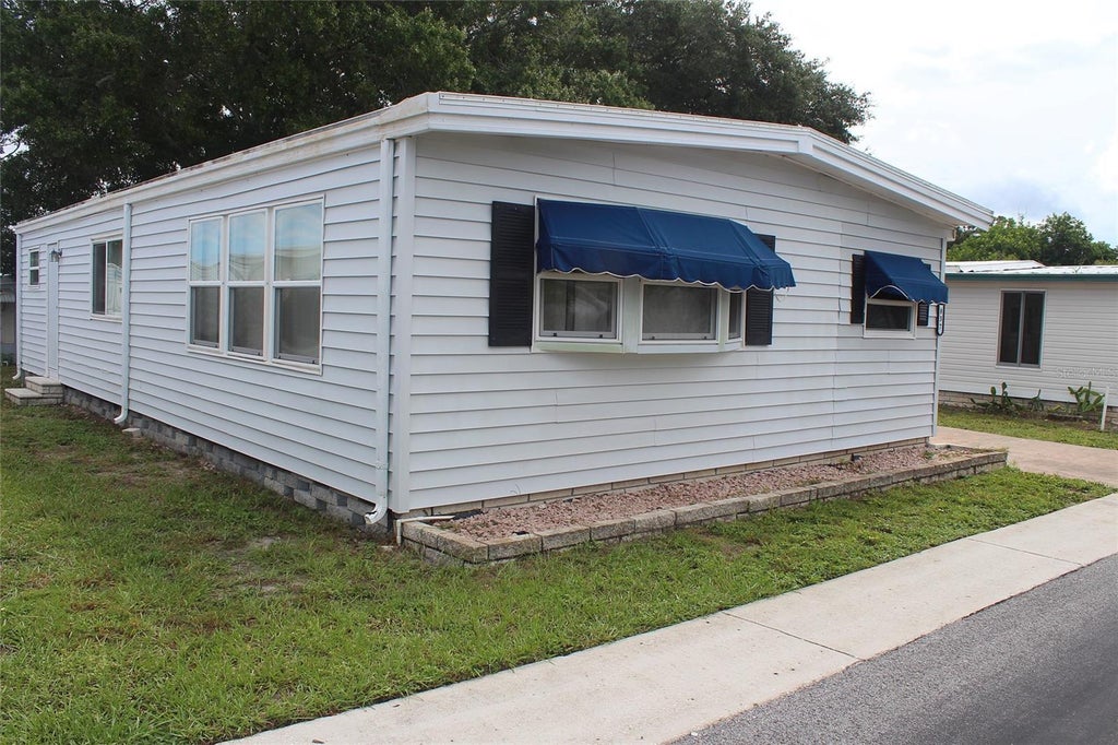 Photo of 837 Cane Palm Street, Largo, FL 33778 (MLS # TB8554252)