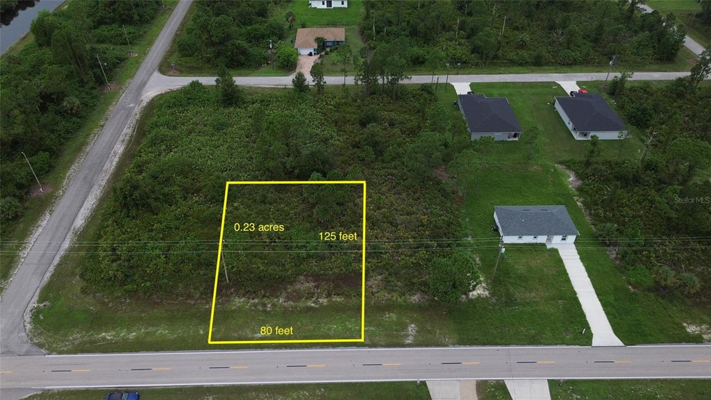 Photo of 464 Columbus Boulevard, Lehigh Acres, FL 33974 (MLS # O6451300)