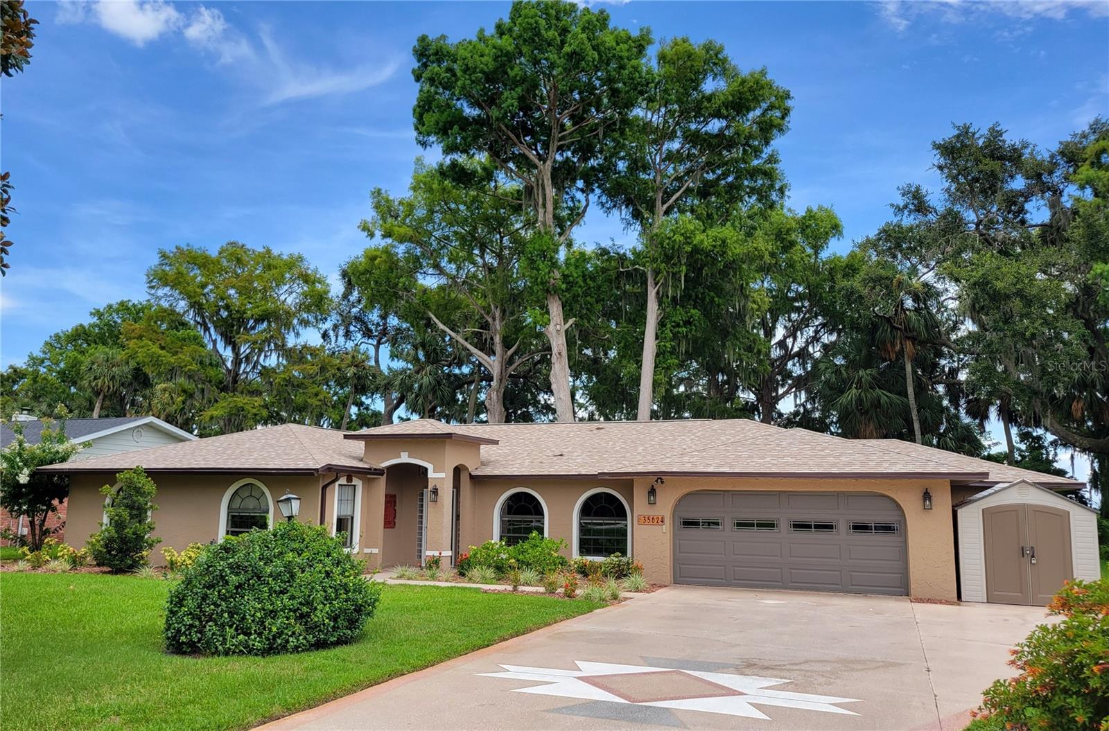 This Harris Chain of Lakes waterfront home in beautiful Harbor Shores can be your next home or vacation retreat! this offers a rare combination of entertainment space, comfort, and access to one of the best waterways in Central Florida. With 100 feet of shoreline, a covered boat dock, private boat launch, and a screened heated pool overlooking the water, the home is well-suited for those who value outdoor living, recreational boating, championship fishing, and sailing.
The residence features a spacious layout with a new roof (2024), hurricane windows, new HVAC system, and new septic. The master suite includes a large walk-in closet and an en-suite bath. Don’t let the construction date fool you – this home has had major updates since then including tile flooring throughout, large bedrooms, and updated bathrooms. Additional highlights include mature landscaping, amazing ancient cypress trees, 5 zone irrigation pumped from the lake, a 2 car garage, and ample storage.
You can access downtown Tavares, Mount Dora, and Howey-in-the-Hills via the chain of lakes while cruising the Dora Canal, Dead River, and even Silver Springs via the Ocklawaha river.
Private showings available by appointment.