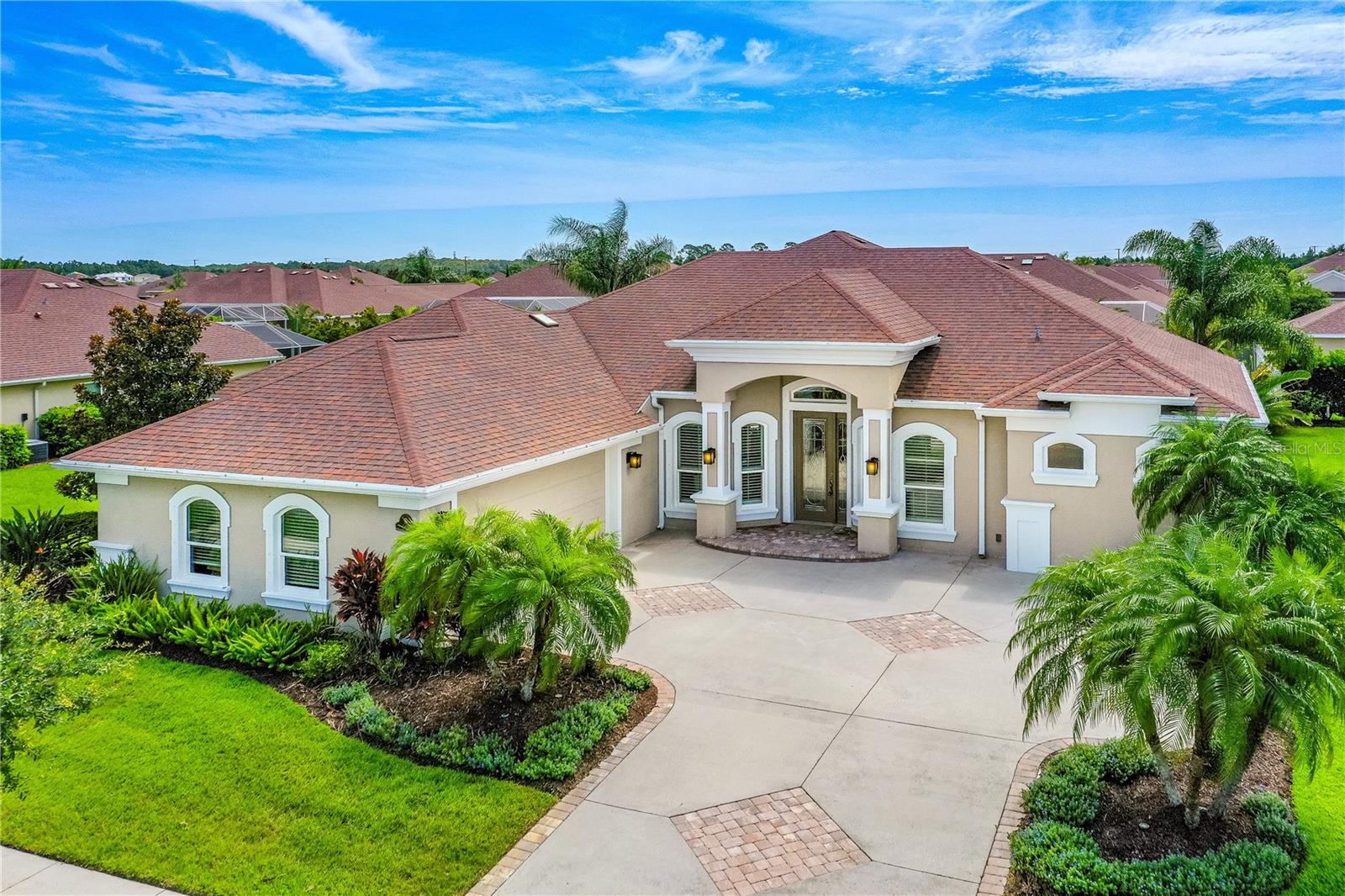 Paytas Built Showcase home in sought after Promenade Parke at Venetian Bay is overflowing with Luxury & Comfort! Beautiful Resort-style Saltwater, Heated Pool with Tranquil Waterfall feature, 565 sq. ft of covered lanai that includes a Gas Fireplace Gathering Area & Expansive Open Deck surrounded by 920 sq. ft. Screen Enclosure all merge perfectly for Large Scale Entertaining or Quiet Evenings at home. The Triple Sliding Doors to the Living Room Nest into the Wall Seamlessly joining Outdoor & Indoor Areas for Florida Living at its Best! Inside you'll find: 10' Ceilings, Upgraded tile flooring & an Open, Split Bedroom Floorplan filled with natural light & Plenty of Storage throughout providing Luxurious Elegance at Every Turn. Large, Single-slab Granite Island & Casual Breakfast Nook make Cooking and Enjoying Meals a pleasure in this Chef's Kitchen with Gas Cooktop & Double Ovens. The private Primary Retreat is Spacious with a Large Walk In Closet & Relaxing Spa-like Ensuite Bath offering Oversized L-shaped Step In Shower, Separate Soaking Tub, Private Water Closet, Dual Vanities and a dedicated Makeup area. 2 Guest Bedrooms share a private Wing and a Full Bath while the 4th Bedroom is currently used as a Den, ideal for a home office or Flexible living space. Separate laundry room with ample storage. Oversized 2 Car Side Entry Garage. Pocket doors give this home added privacy & space efficiency. Upgraded premium landscaping with irrigation system. Storm Panels for added peace of mind. Built in 2017. Upgraded 18 Seer AC unit. 2022 HWH. Seller has 2017 Land Survey available. Promenade Parke is a separate Community at Venetian Bay. Enjoy the vibrant lifestyle Venetian Bay has to offer with its Charming Town Center, complete with restaurants, shops, scenic Walking/Jogging Trails & a Public Golf Course. Conveniently located in the midst of Everything the Greater New Smyrna Beach Area has to offer, like: Quaint Downtown; tons of Restaurants & Shopping; Major Roads; Institutions of Higher Learning; Hospitals; Museums; Theater and of course it's Beautiful Beach is just minutes away! Plus, enjoy easy access to Orlando attractions & St. Augustine- both just about 1 hour away! Schedule a private tour of this Exceptional Home today! All information is deemed correct but not warranted & measurements are all approximate.