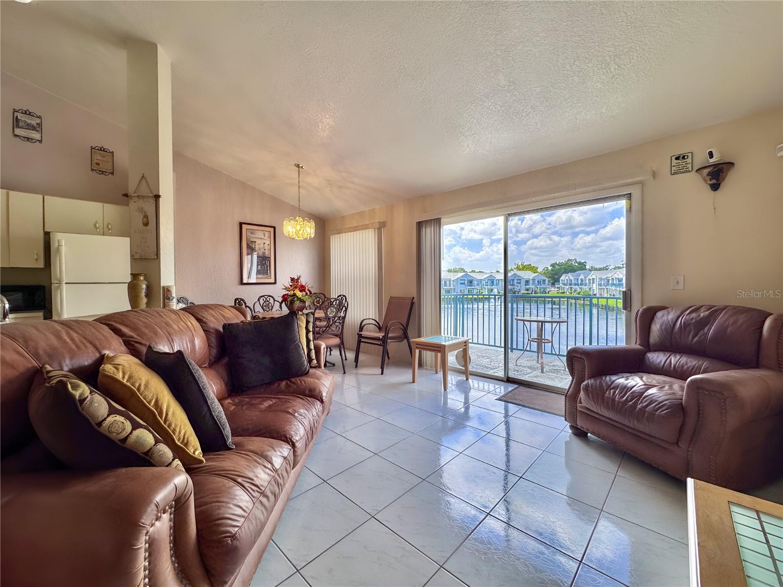 Charming 2-Bedroom Condo in Prime East Orlando Location! Discover the perfect blend of convenience and comfort in this move-in-ready 2-bedroom, 2-bathroom condo located in the vibrant area of East Orlando. Ideally situated just minutes from UCF, downtown Orlando, major hospitals, and Orlando International Airport, this second-floor unit offers all the perks of city living—without the downtown traffic. Step inside to an open floor plan with soaring ceilings and ceramic tile flooring throughout—no carpet anywhere! The spacious layout features two generously sized bedrooms, two full bathrooms, and a private balcony with peaceful pond views—perfect for relaxing after a long day. This super clean unit is move-in ready and located in a resort-style community offering fantastic amenities, including a sparkling pool, fitness center, and clubhouse. Whether you’re a first-time buyer, downsizing, or investing, this condo is a must-see!
